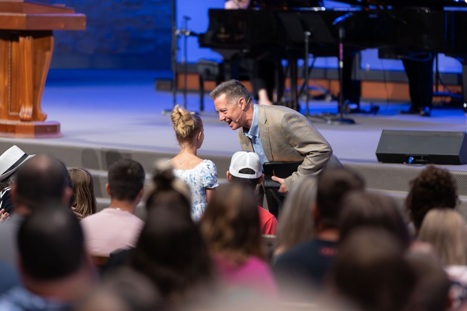 An engaging moment during a church service with the audience in the foreground.