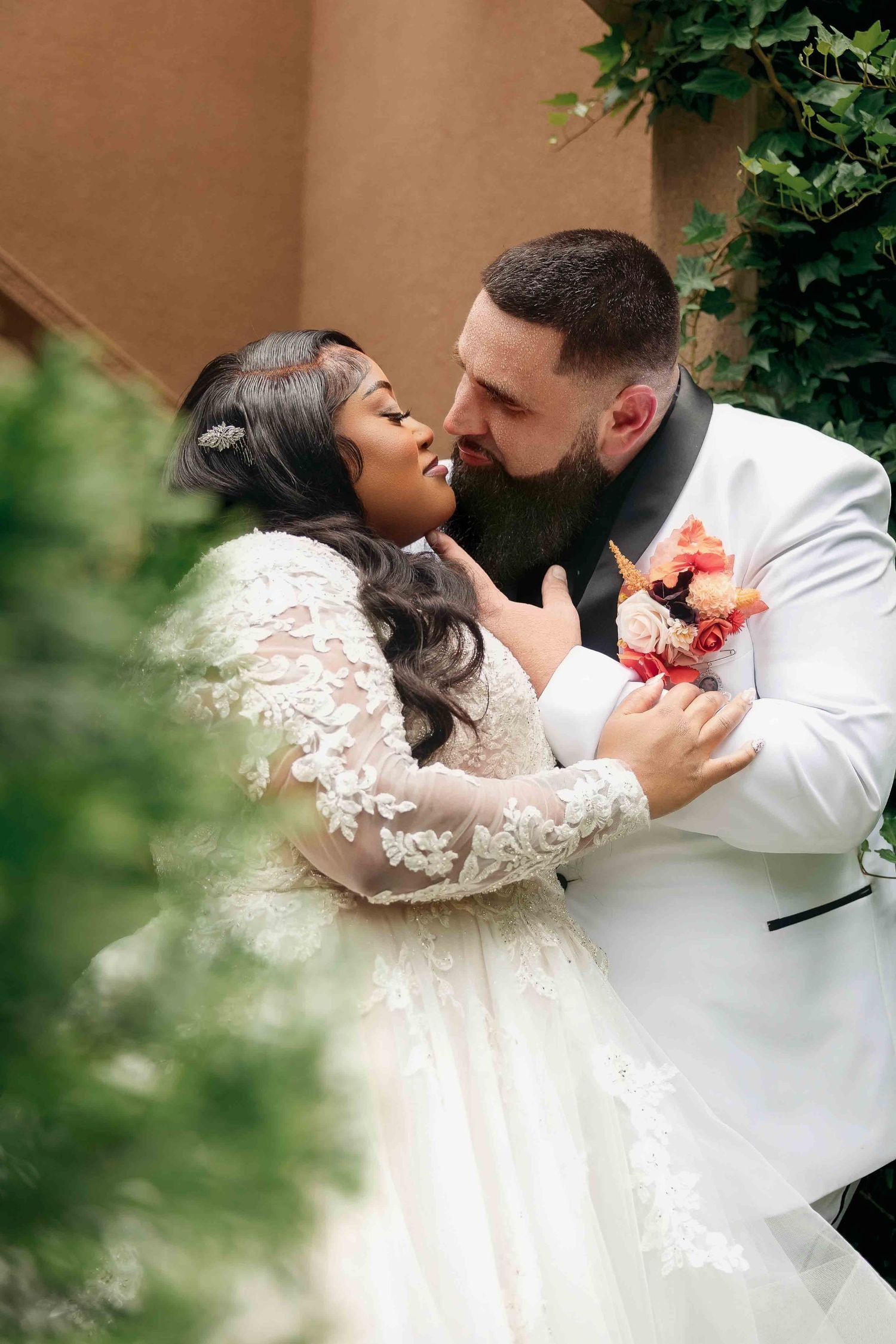 Bride and groom share a kiss during their wedding at The Castle at Wildwood Gardens
