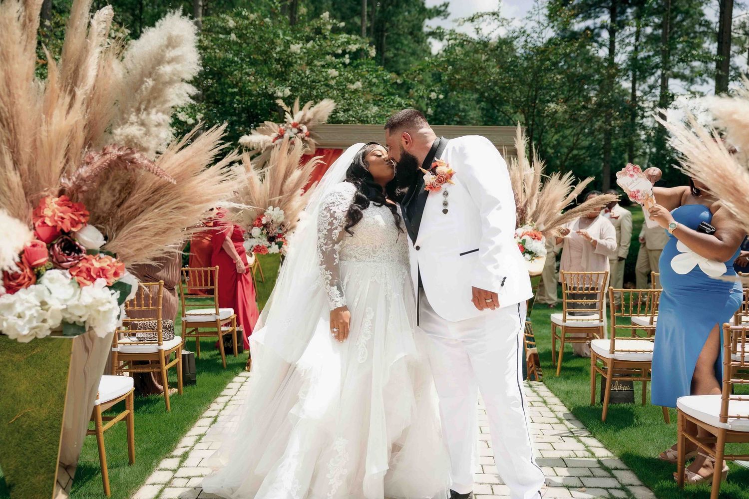 Bride and groom share a kiss during their Castle at  the Wildwood Gardens ceremony,
