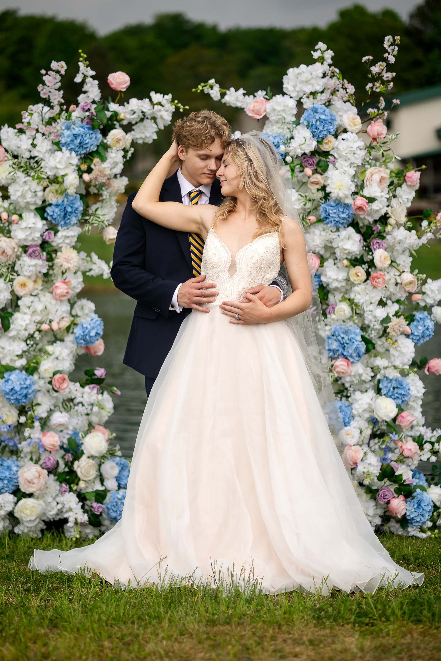 Bride and groom sharing a romantic portrait at willow tree farms