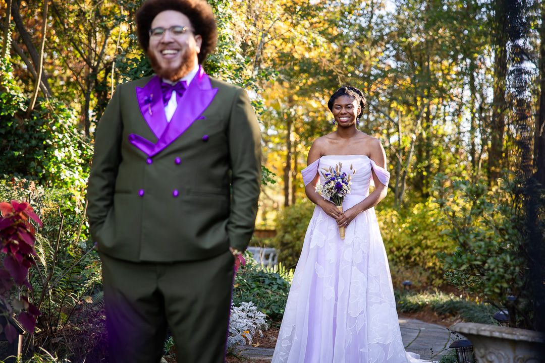 Bride and groom first look at Four Oaks Manor, captured in natural true-to-color wedding photography