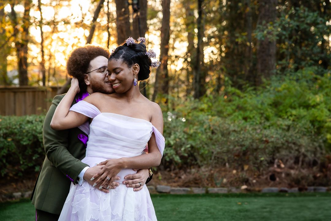 bride and groom sharing an intimate moment in golden hour at Four Oaks Manor