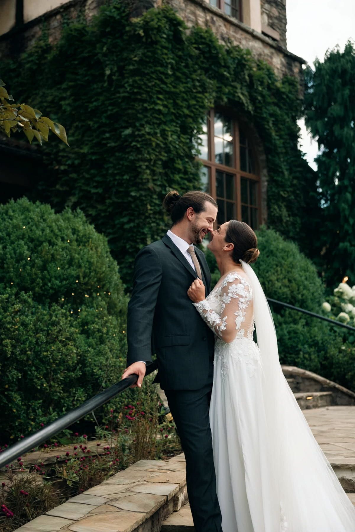 Bride and groom share a romantic moment outside their wedding venue in Savannah georgia