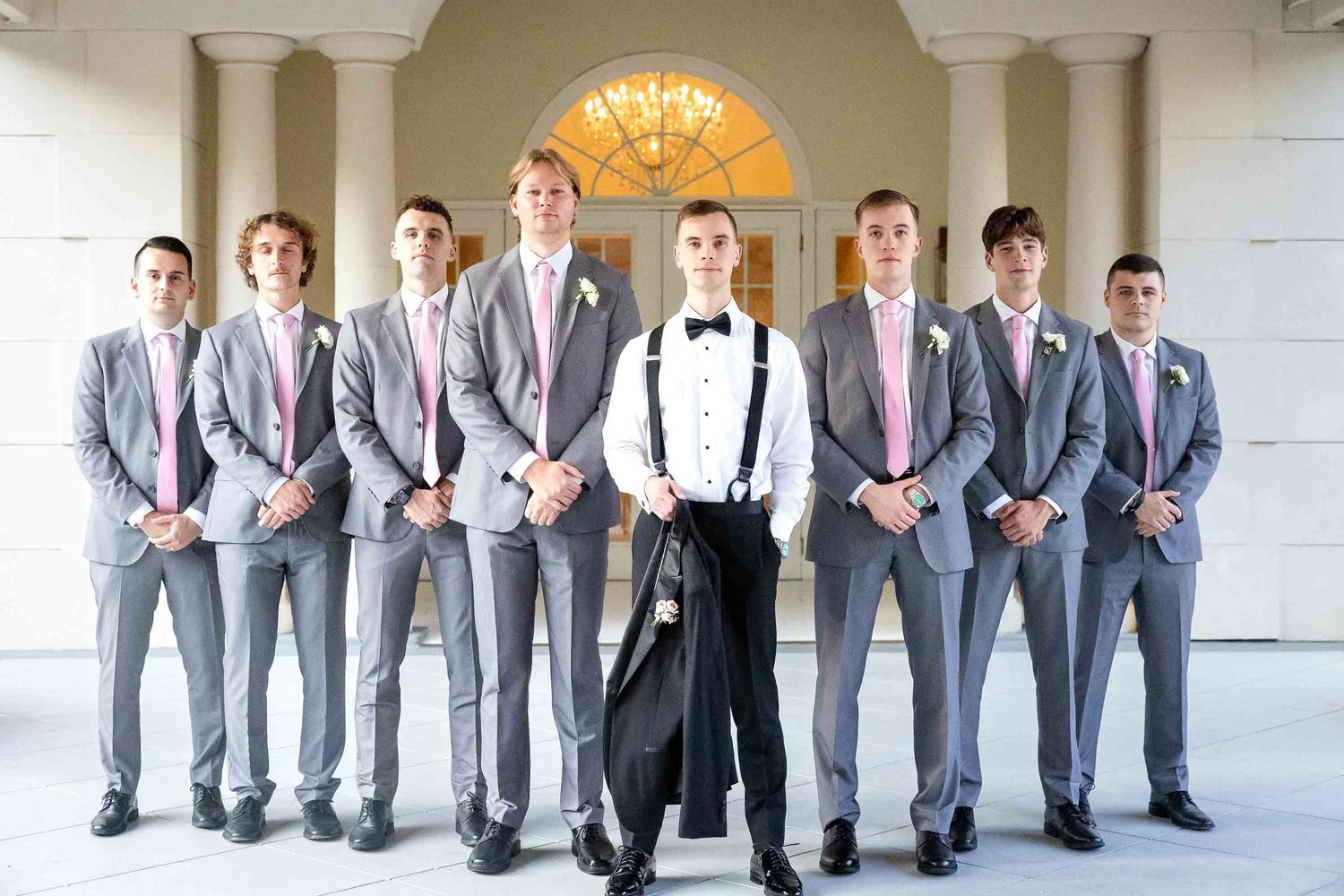 A wedding party pose at ashton gardens wedding venue