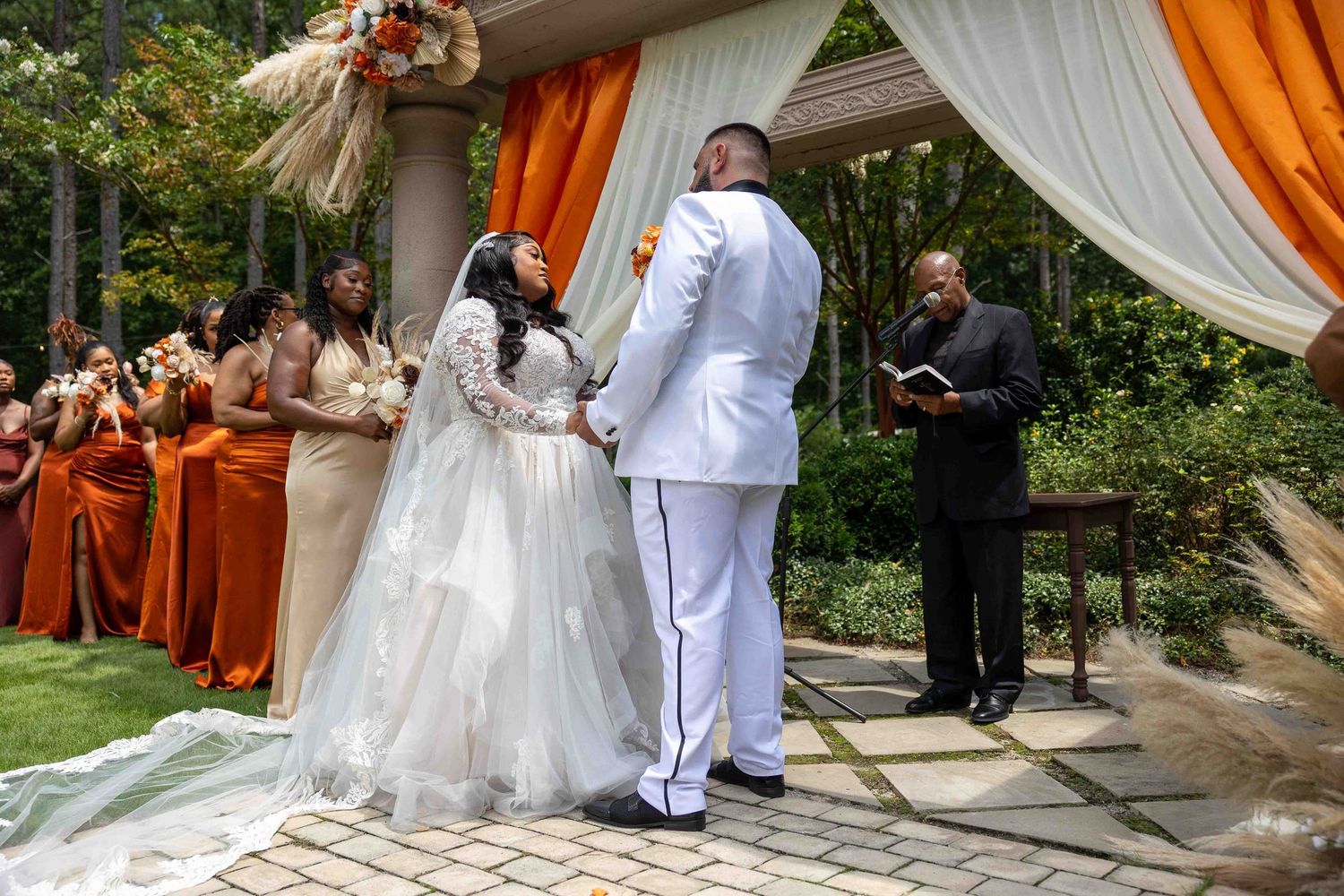 A beautiful outdoor garden wedding ceremony  at The castle at wildwood gardens