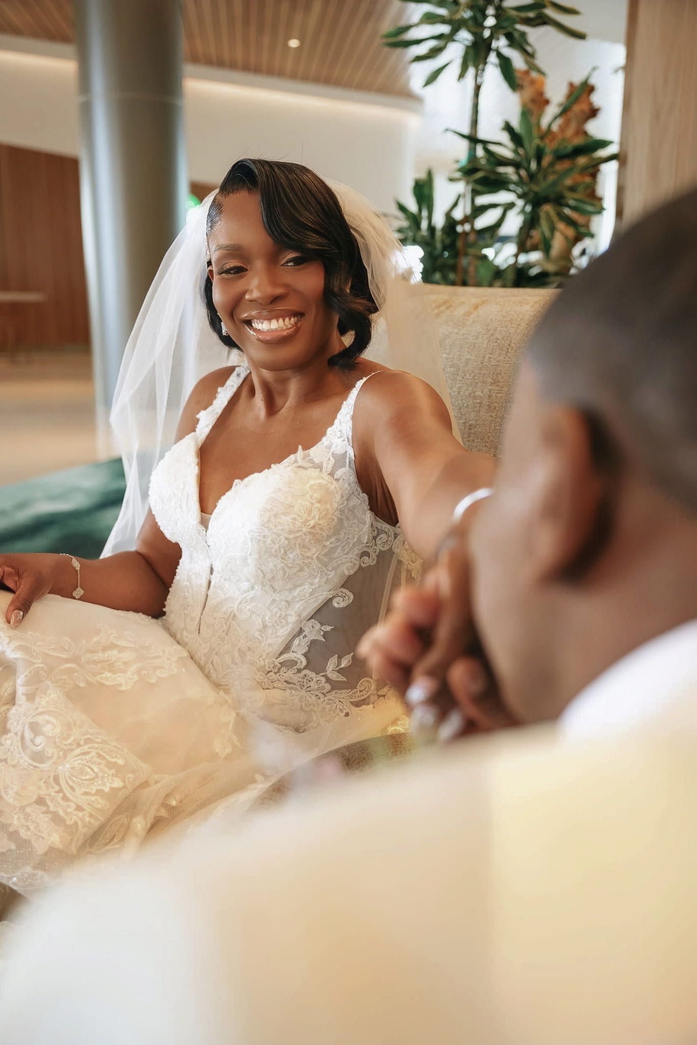 Groom kisses bride's hands during their wedding ceremony at the westin gwinnett atlanta