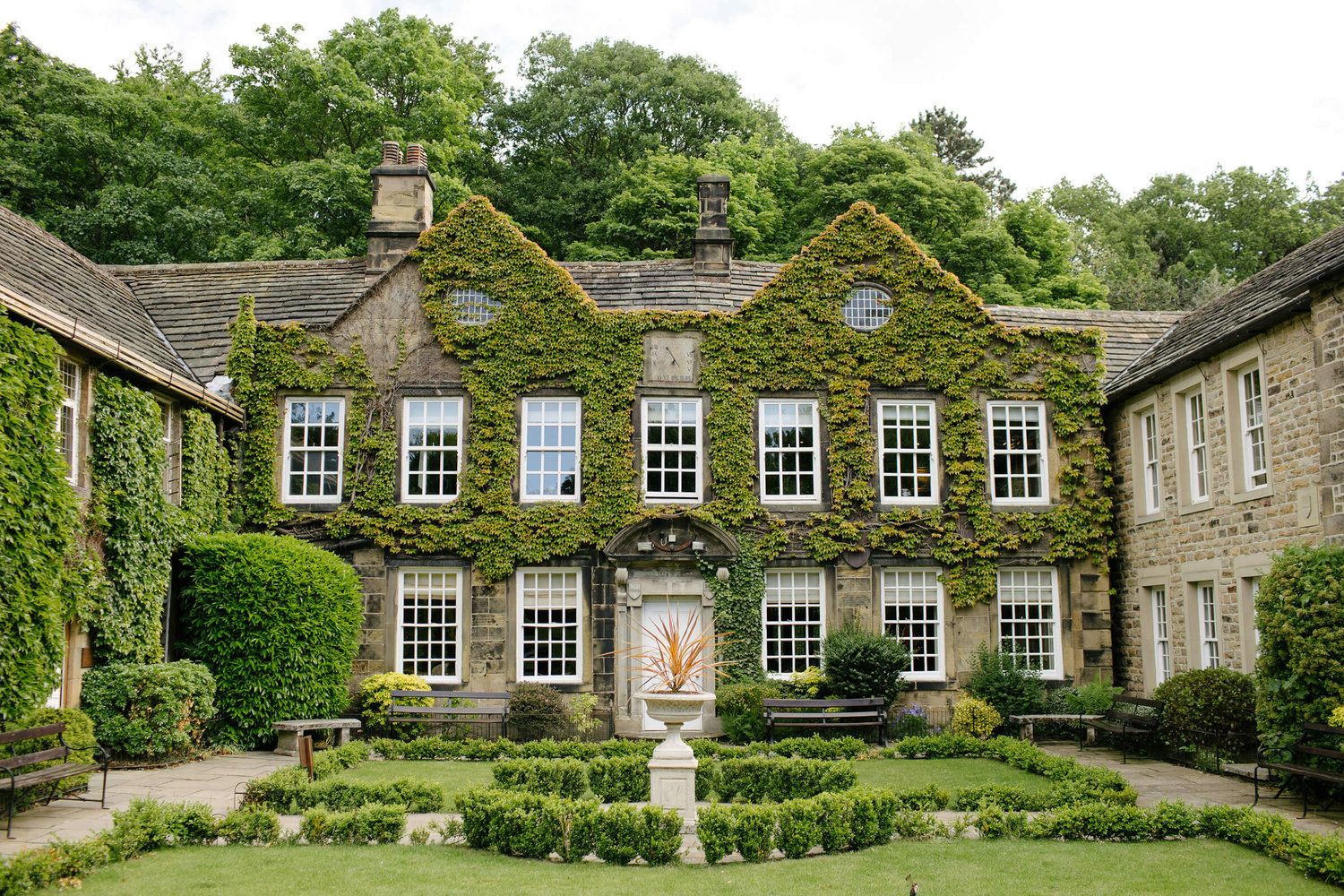 Collage of stone farmhouse exteriors with flowering gardens and traditional architectural elements in the English countryside.
