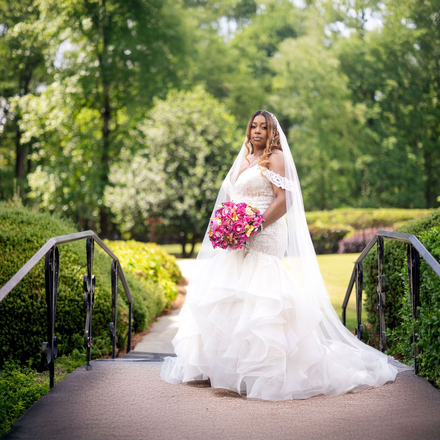 Bride posing in the lakeside garden at Pristine Chapel wedding venue in Atlanta, Georgia.
