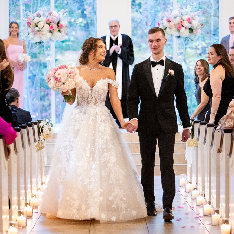 bride and groom walking down the aisle at ashton gardens in atlanta