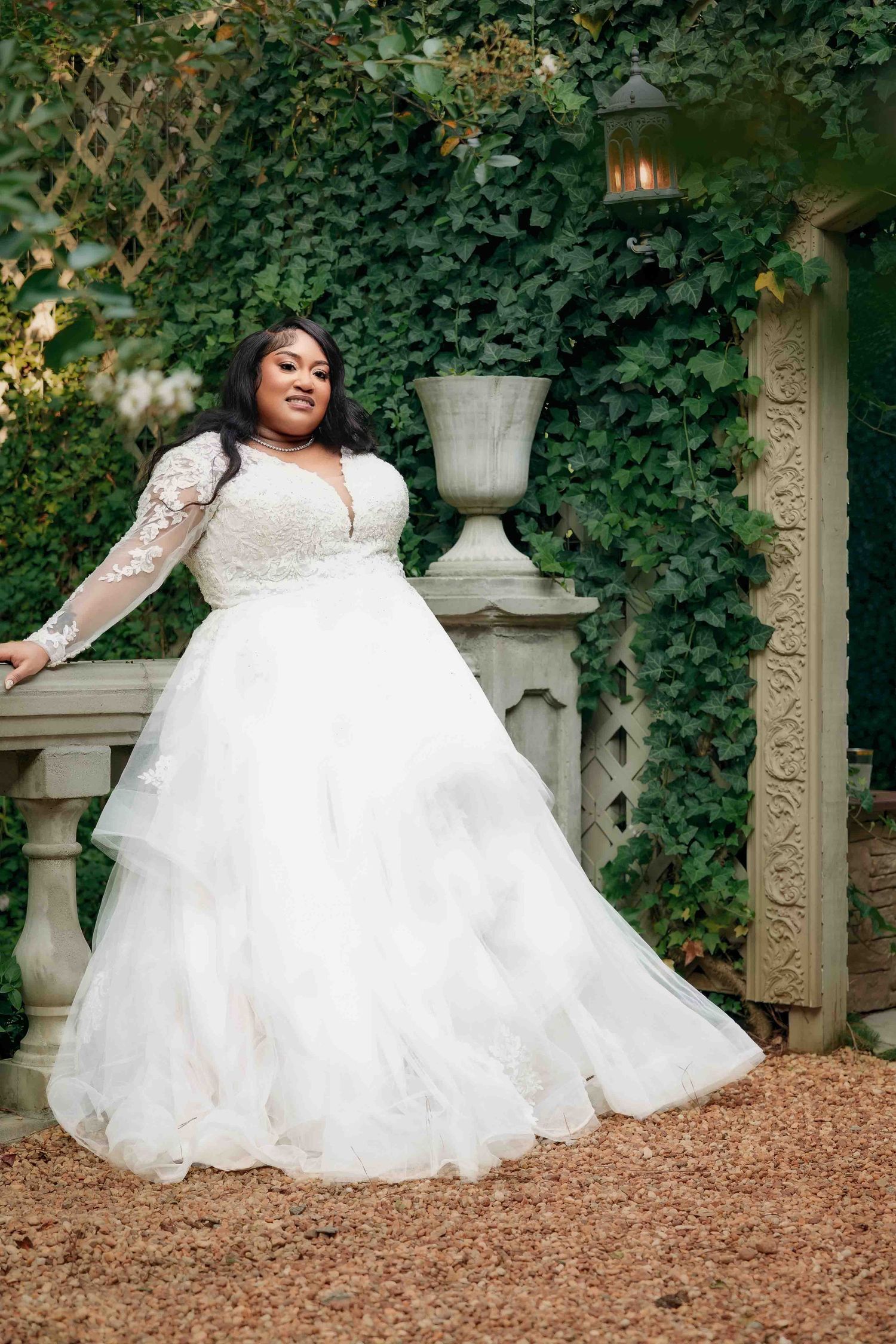 Elegant bridal portrait in garden courtyard of The Castle at Wildwood Gardens