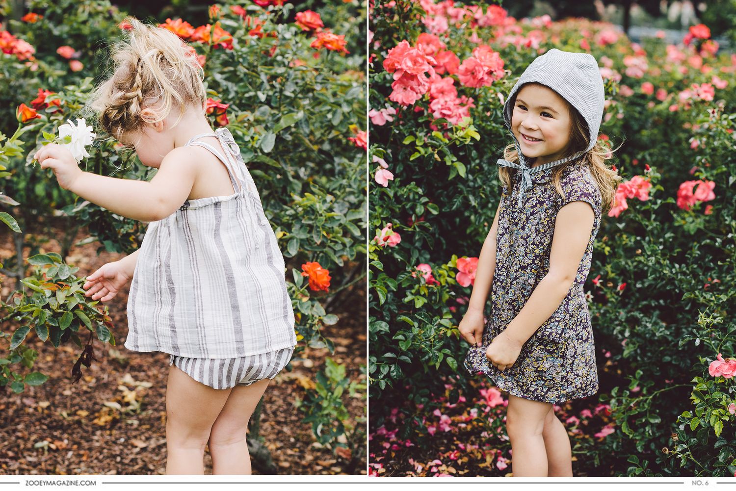 Two young children wearing dresses exploring and playing among colorful blooming rose bushes in a garden.