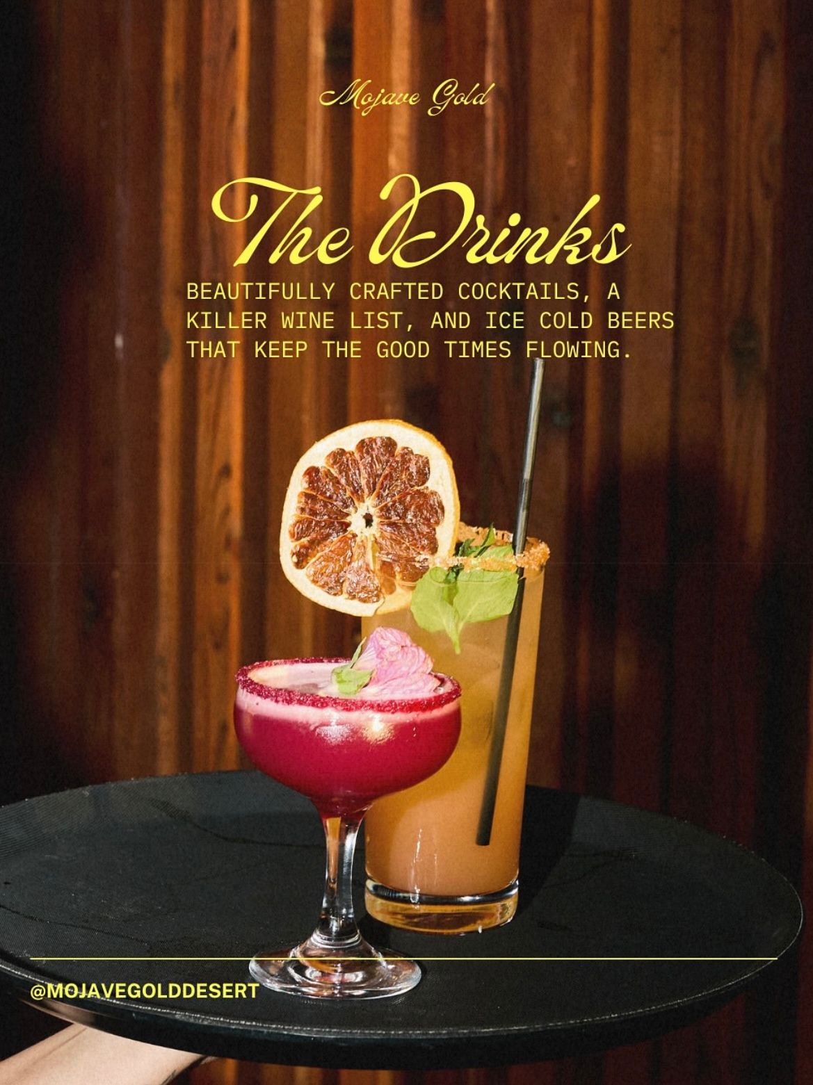 Four colorful craft cocktails with citrus garnishes on dark surfaces against a wooden backdrop.