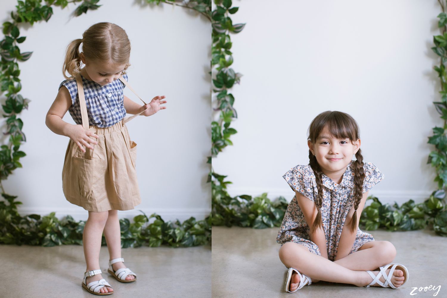 Two portraits against white wall with ivy decor showing child in gingham top and beige pinafore dress.