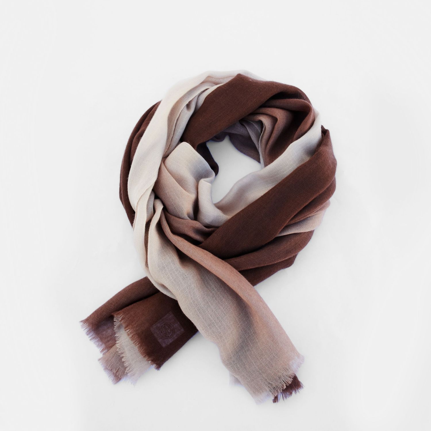 Elegant brown and beige ombre scarf wrapped in soft folds on white background.