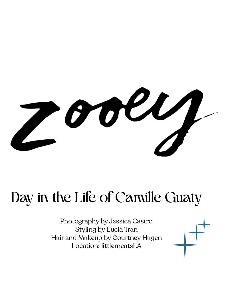 A stylized black silhouette logo design of the word 'zooey' with small blue cross marks in the bottom right corner.