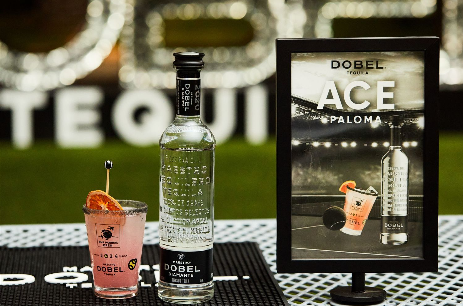 Dobel Ace tequila bottle and cocktail displayed with promotional signage.