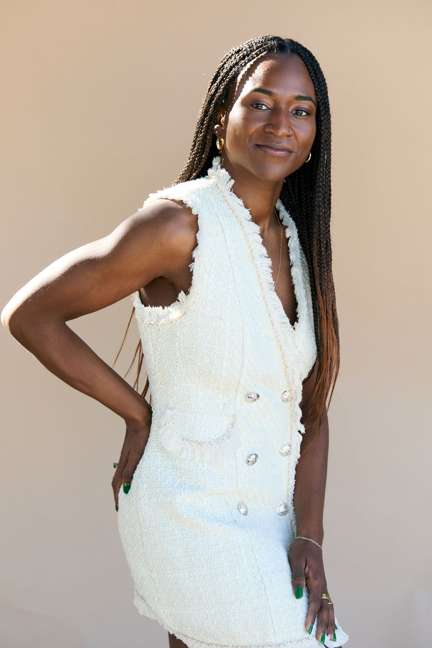 Fashion portraits in textured white sleeveless top with delicate details.