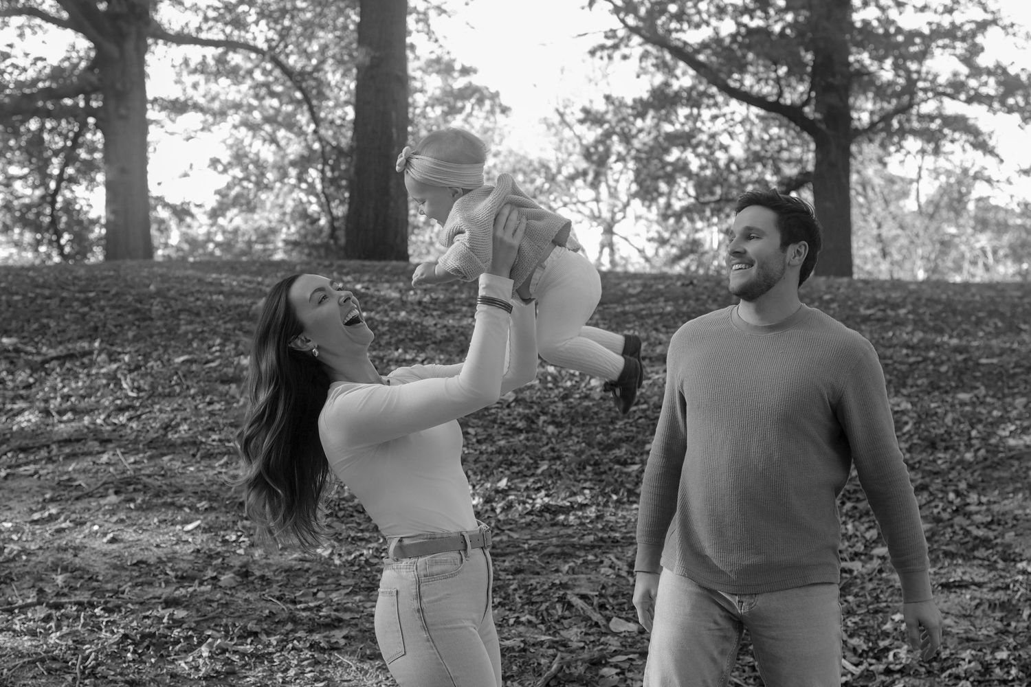 Black and white photo series of family posing for family photos.