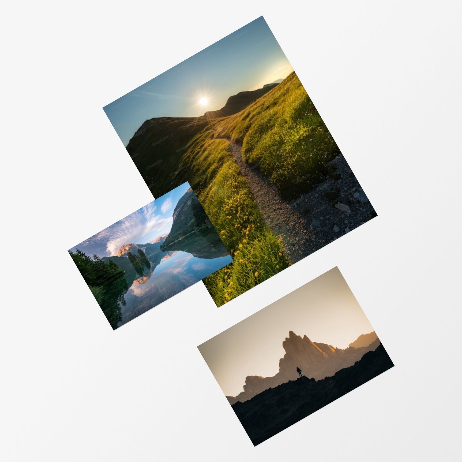 Three landscape photo prints scattered on white background featuring mountain trails, lake reflections, and rocky peaks.