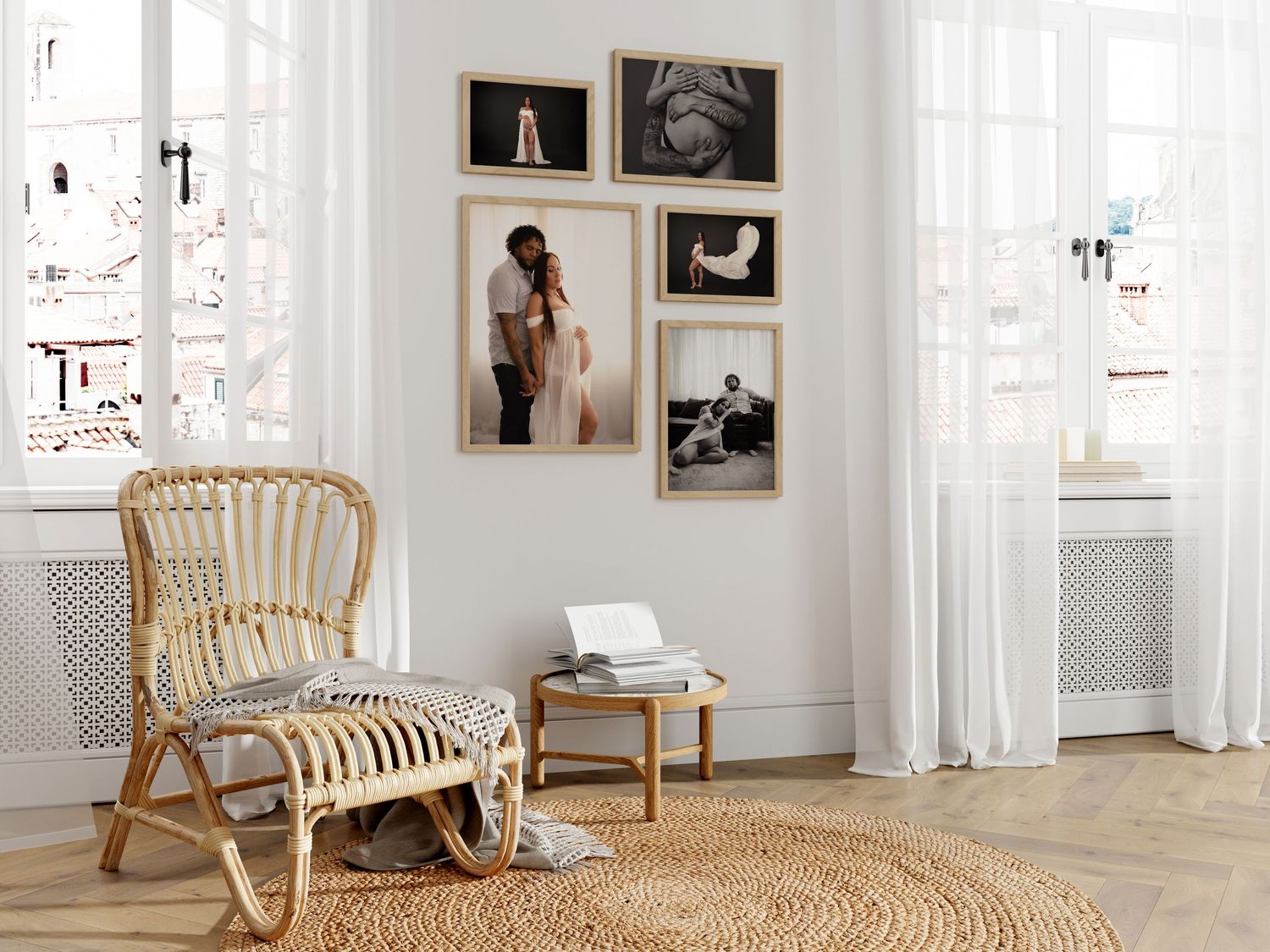 Bright white modern living room with rattan lounge chair and framed gallery wall art display.
