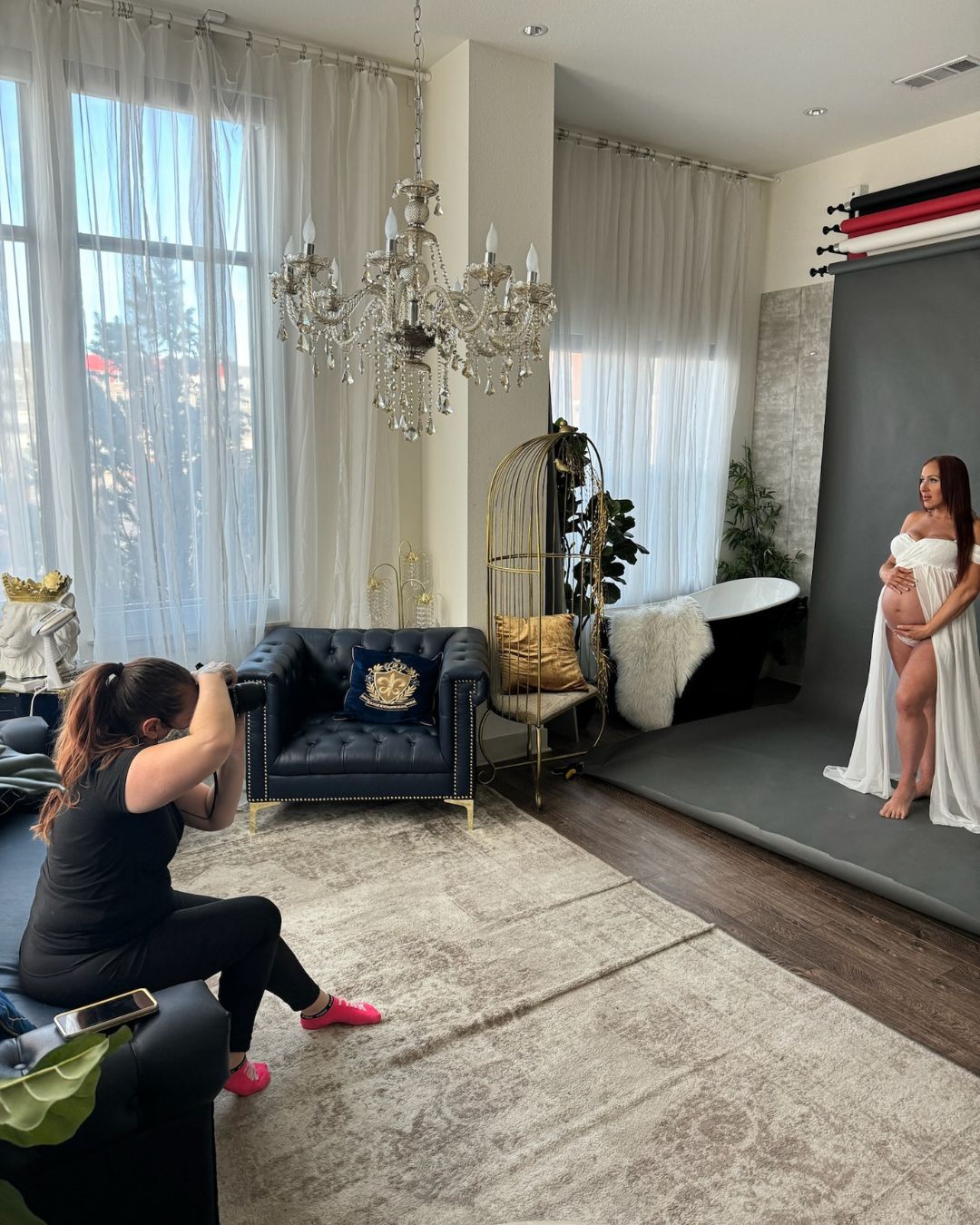 Behind-the-scenes of Denver maternity and birth photographer Amanda Wyman photographing a studio maternity session.