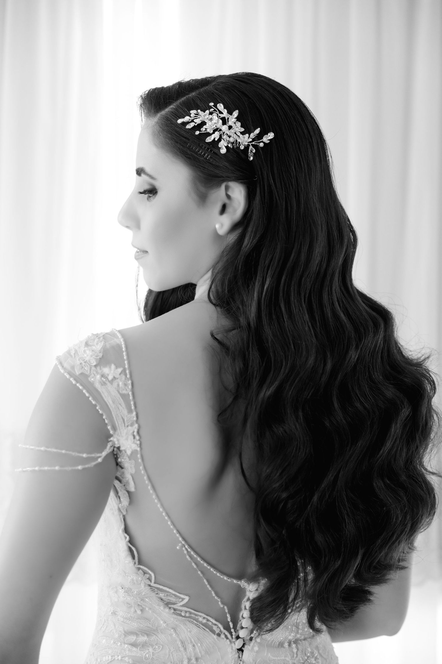 Black and white portrait series showing vintage-style bridal hairstyle with delicate hair accessories from different angles.