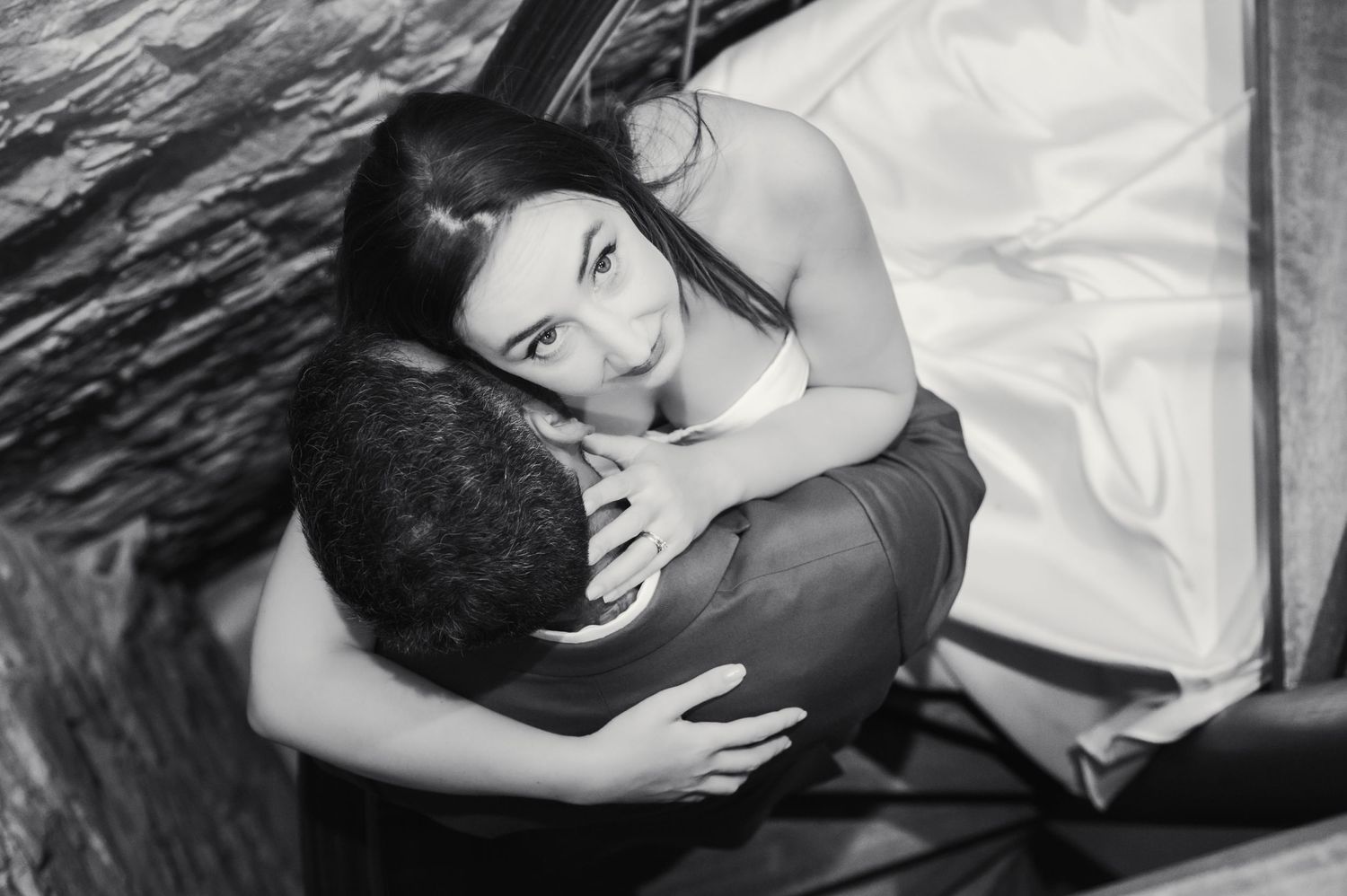 Intimate black and white portrait of couple embracing.