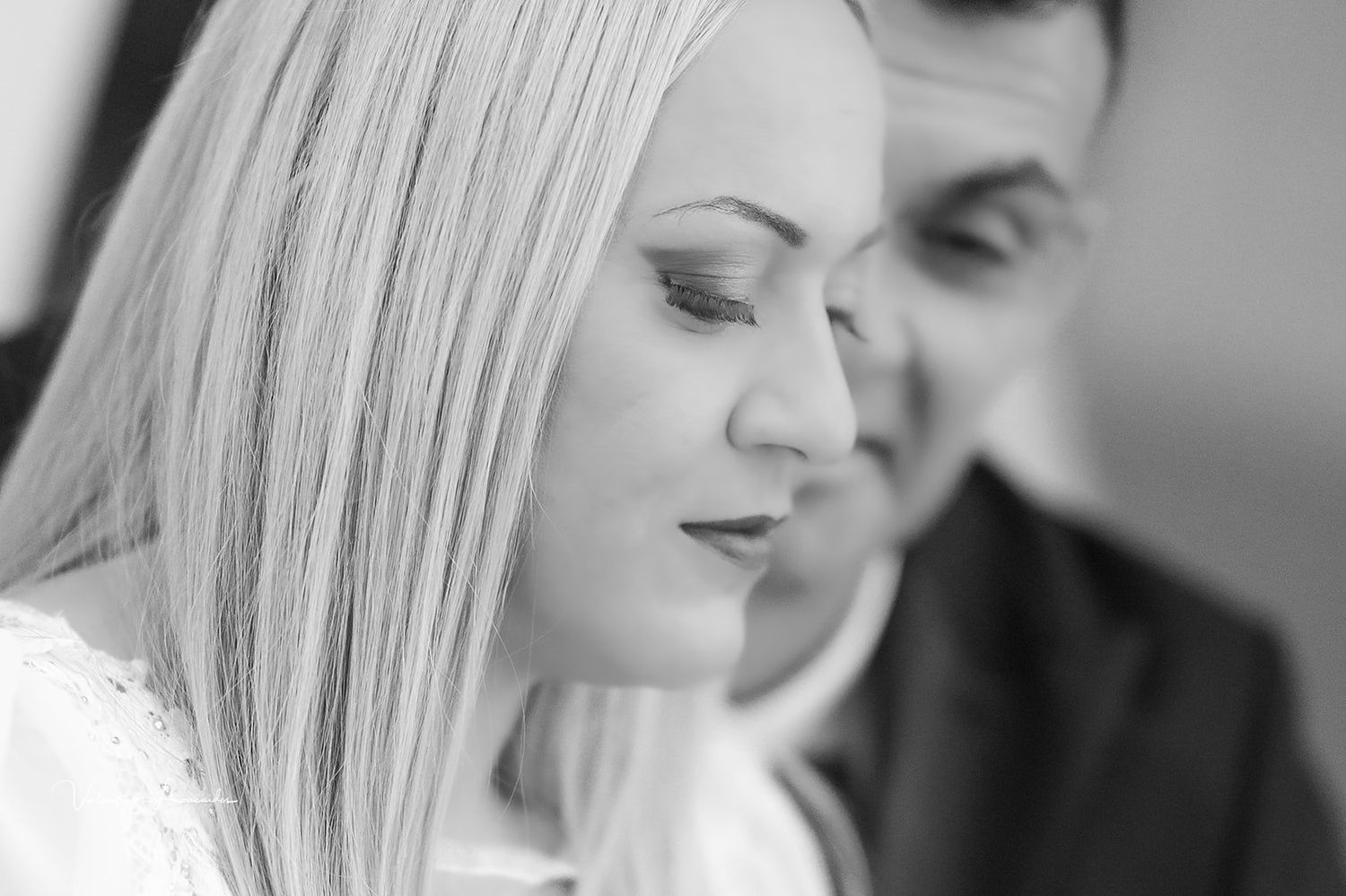 Intimate black and white close-up profile portrait of bride and groom.