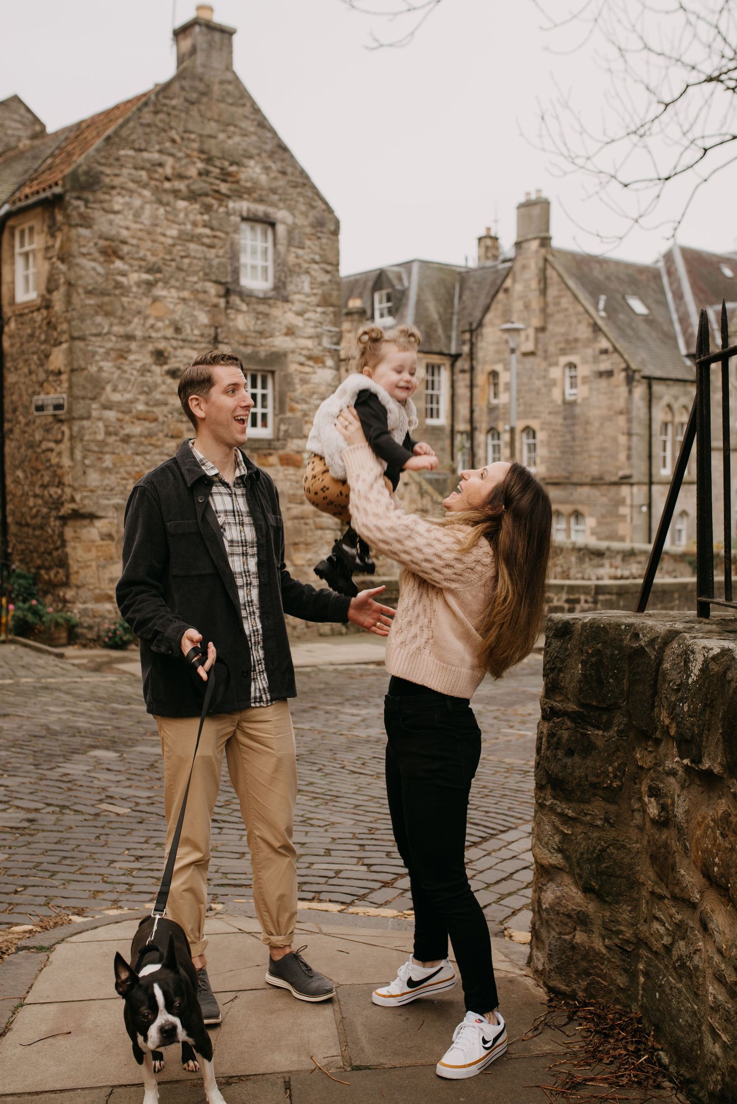 mum, dad, daughter and dog during a casual and candid family photoshoot in dean village in Edinburgh