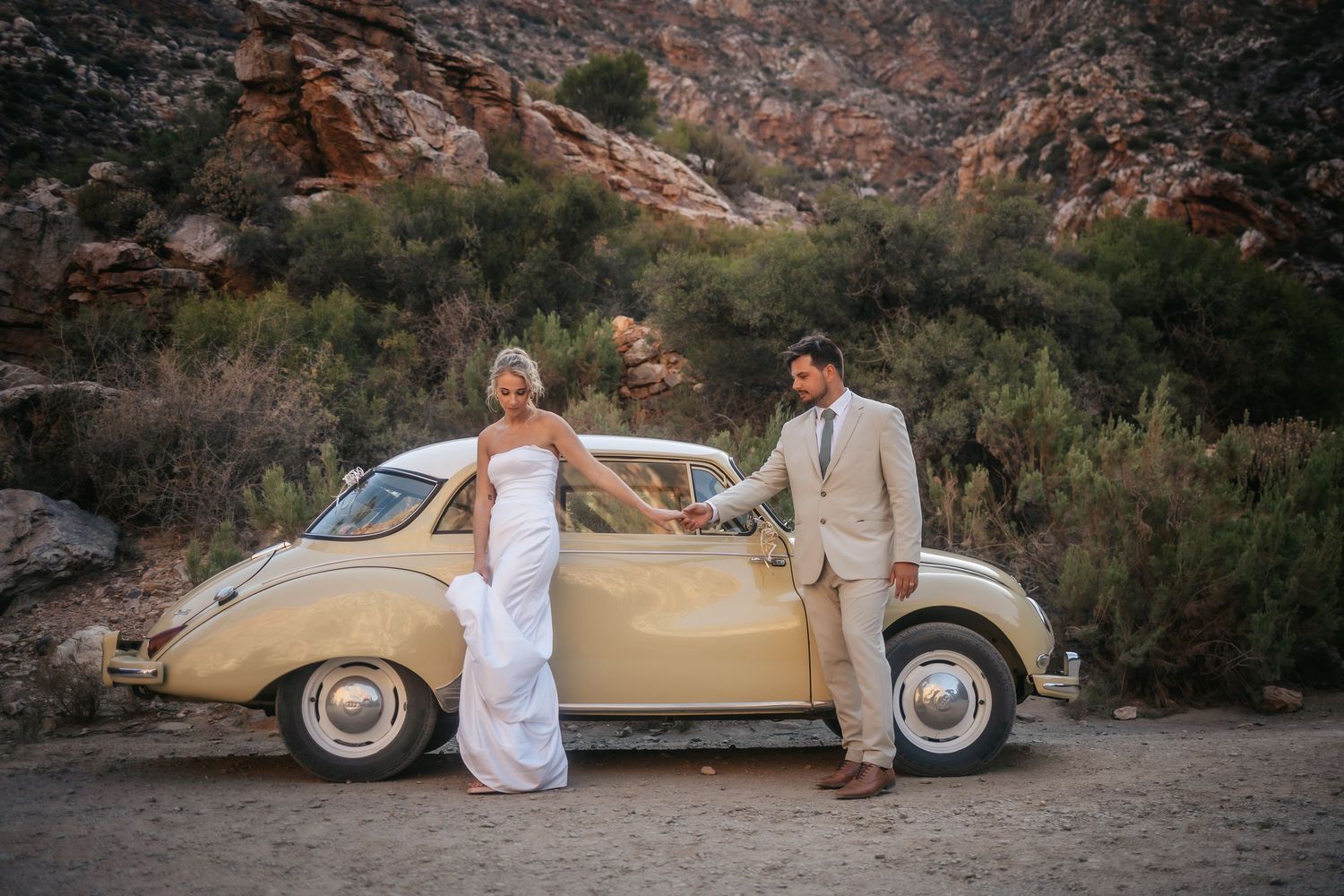 Wedding photography by Crimson and Vow showing a bride and groom hugging at a scenic wedding venue in George, Garden Route.