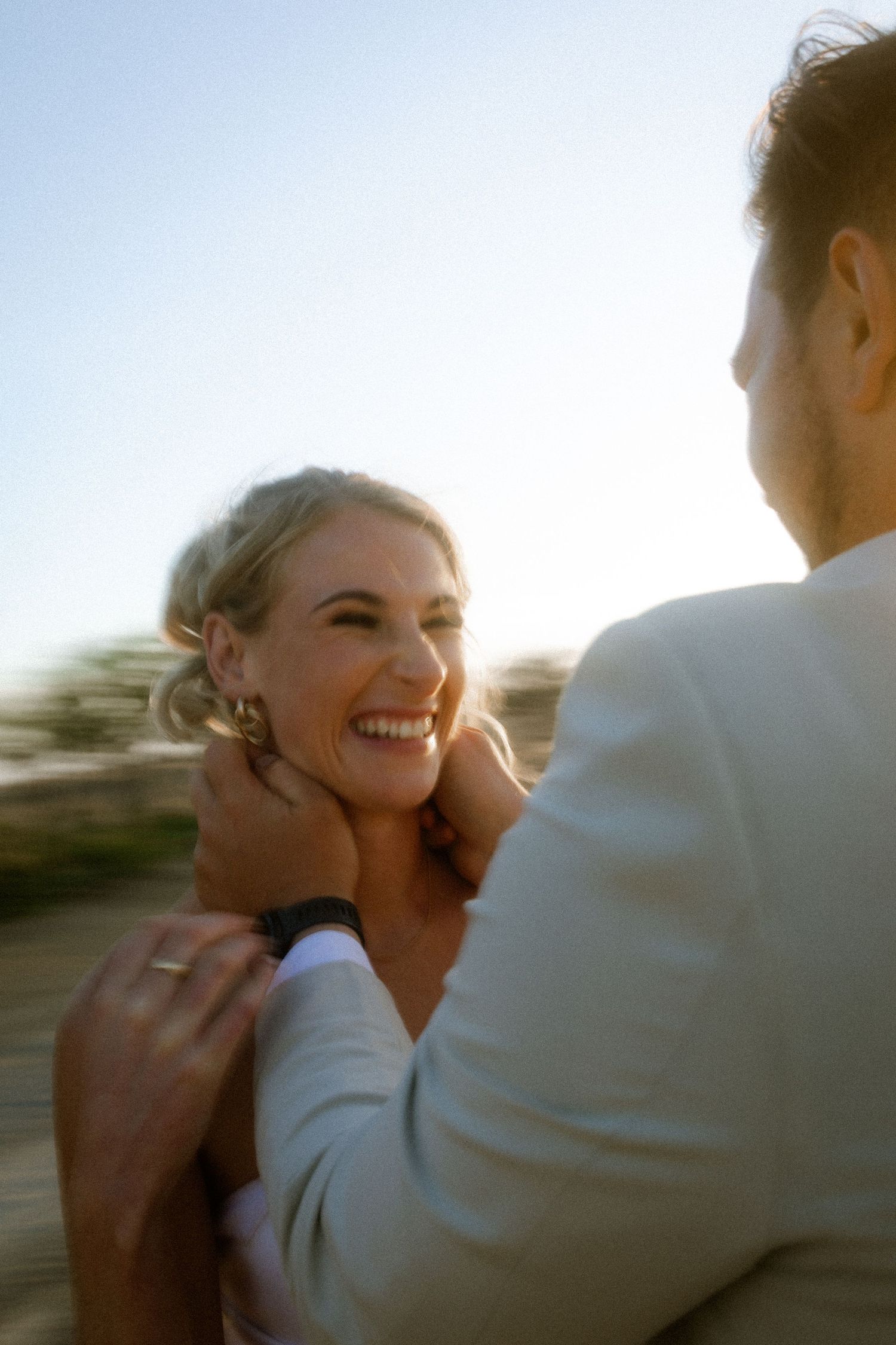 Wedding photography by Crimson and Vow showing a bride and groom hugging at a scenic wedding venue in George, Garden Route.