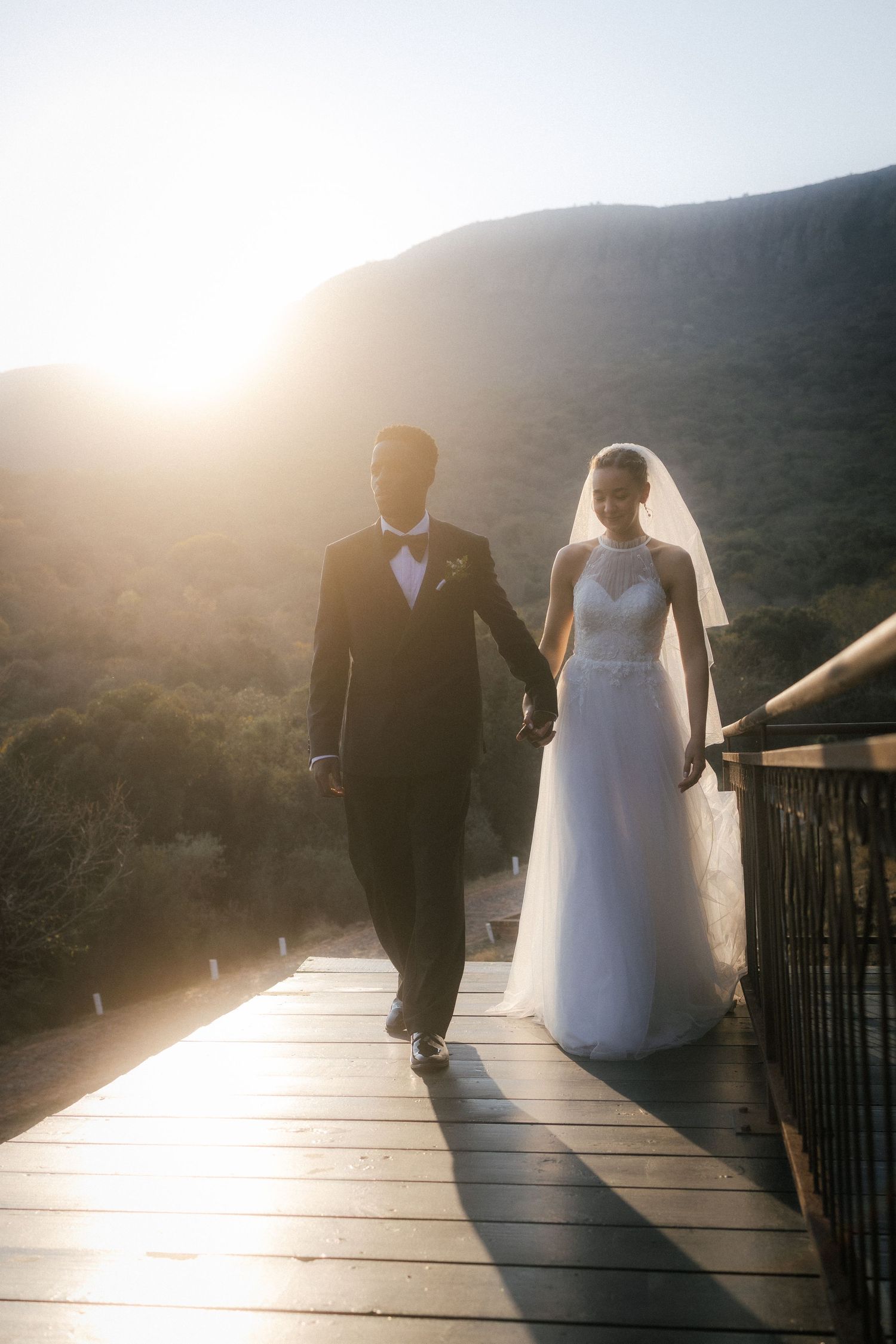 Wedding photography by Crimson and Vow showing a bride and groom hugging at a scenic wedding venue in George, Garden Route.