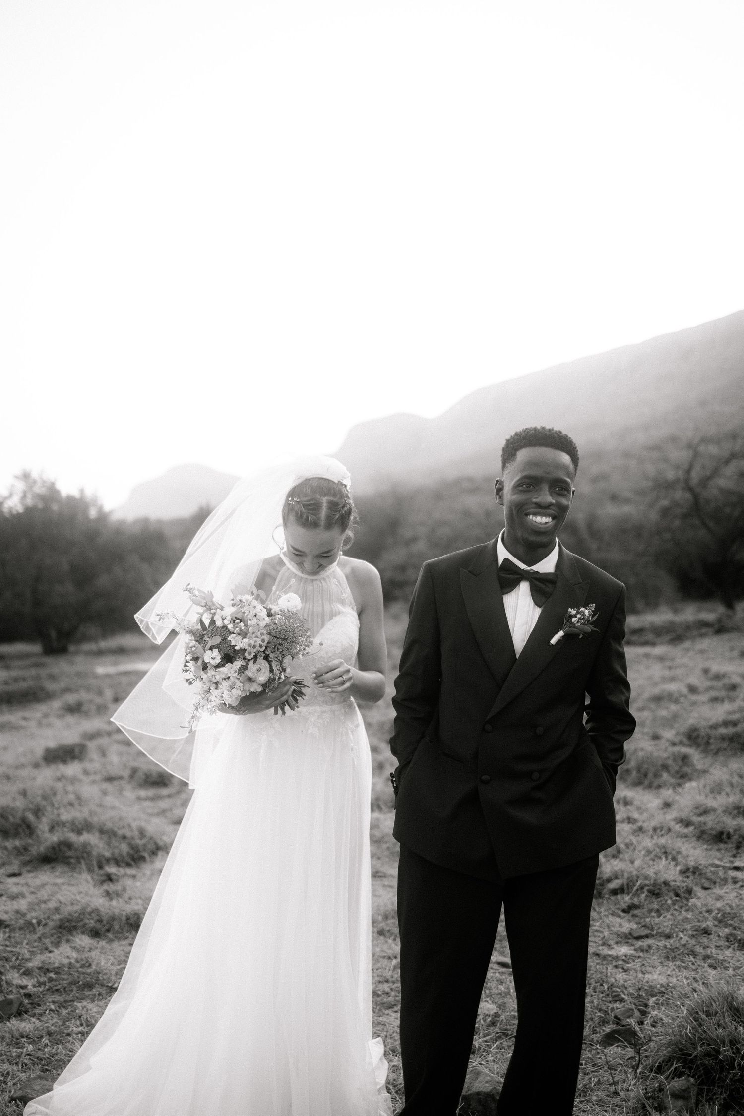 Wedding photography by Crimson and Vow showing a bride and groom hugging at a scenic wedding venue in George, Garden Route.