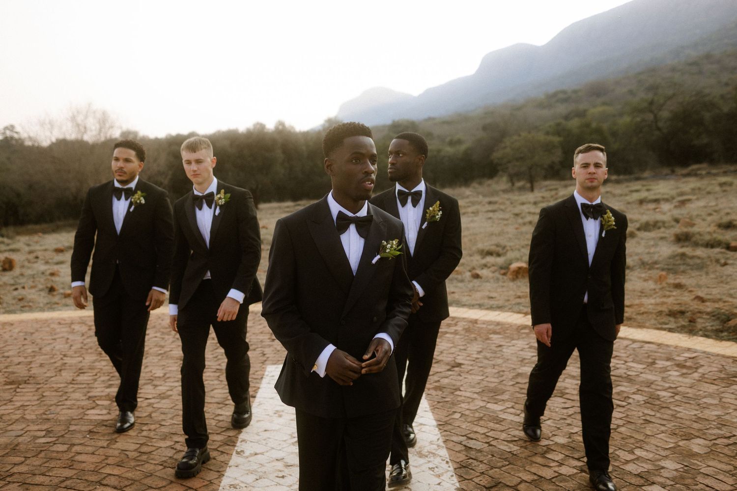 Wedding photography by Crimson and Vow showing a bride and groom hugging at a scenic wedding venue in George, Garden Route.