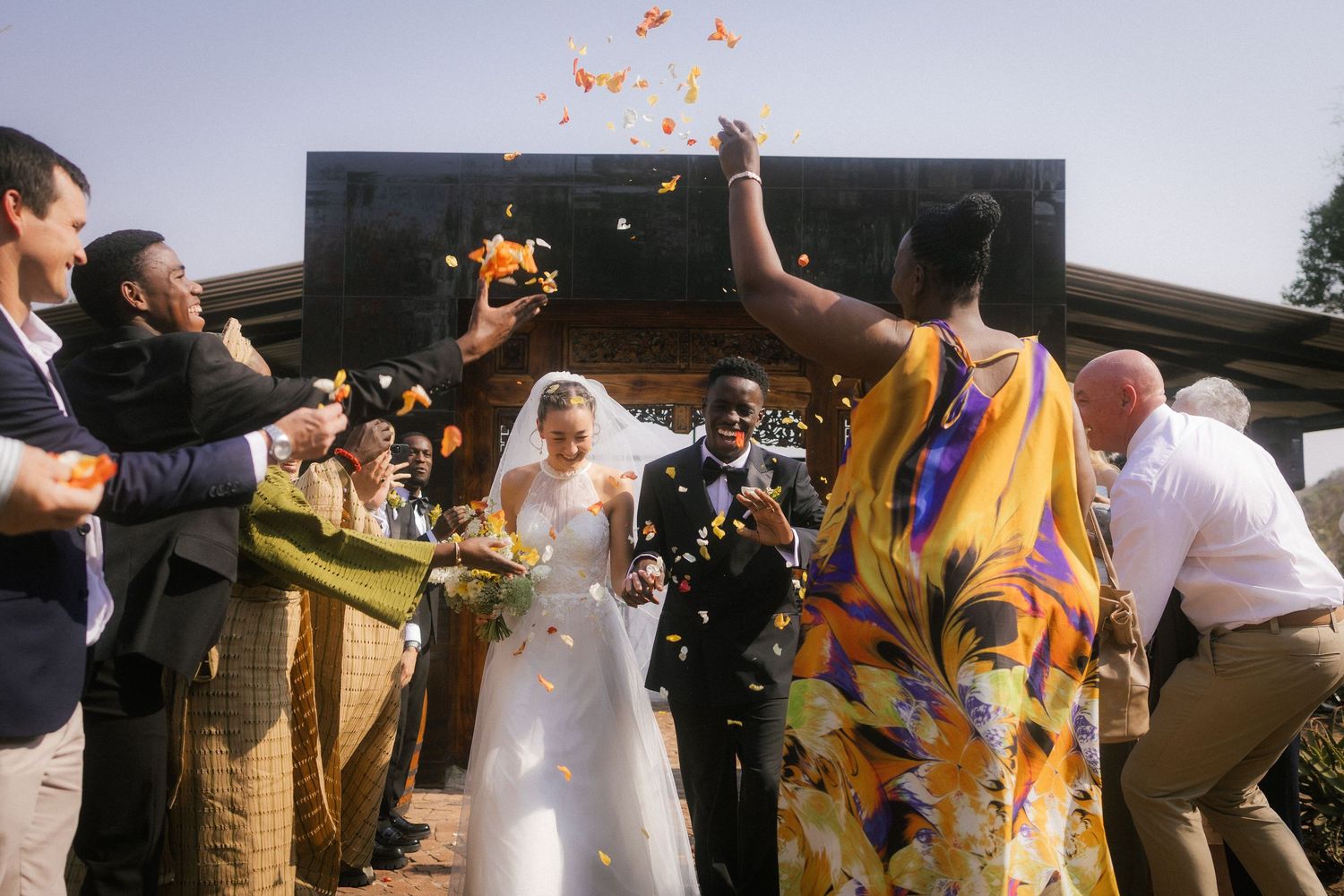 Candid wedding photo by Crimson and Vow of laughing bridesmaids in the forest in Knysna, Garden Route