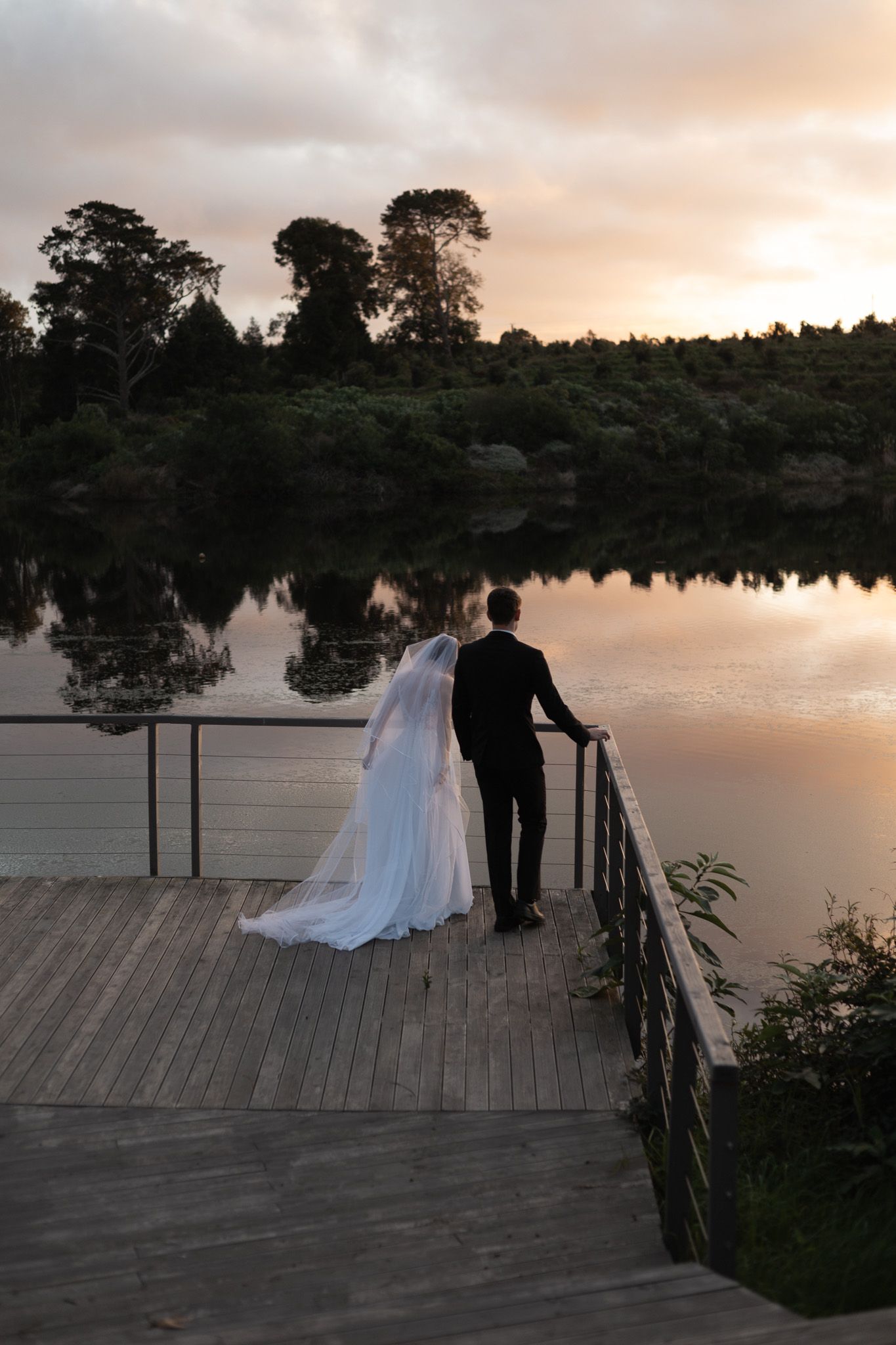 Wedding photography by Crimson and Vow showing a bride and groom hugging at a scenic wedding venue in George, Garden Route.