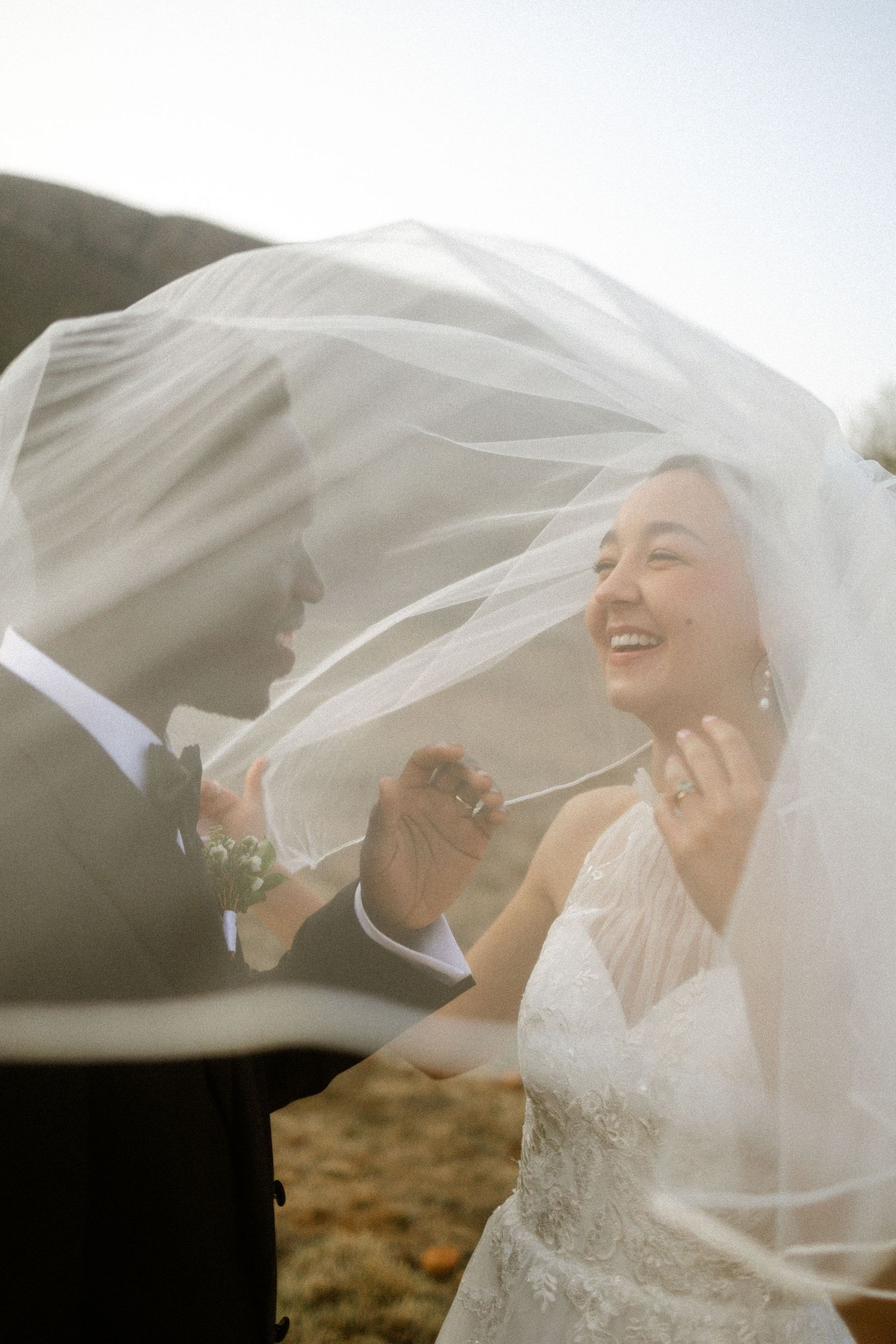 Wedding photography by Crimson and Vow showing a bride and groom hugging at a scenic wedding venue in George, Garden Route.