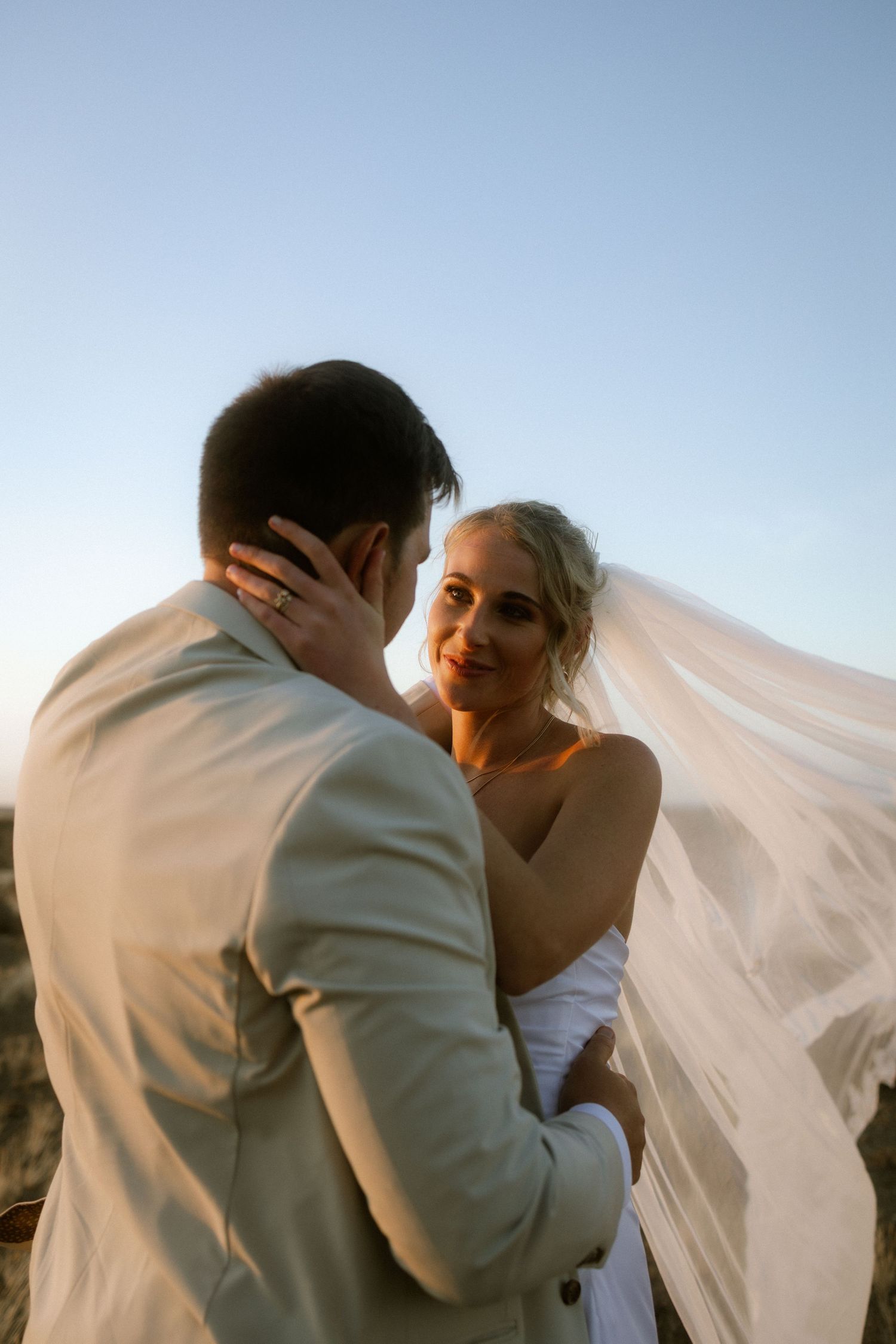 Wedding photography by Crimson and Vow showing a bride and groom hugging at a scenic wedding venue in George, Garden Route.