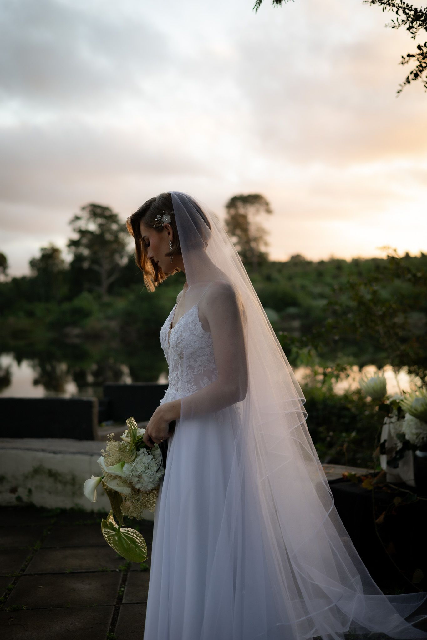 Wedding photography by Crimson and Vow showing a bride and groom hugging at a scenic wedding venue in George, Garden Route.