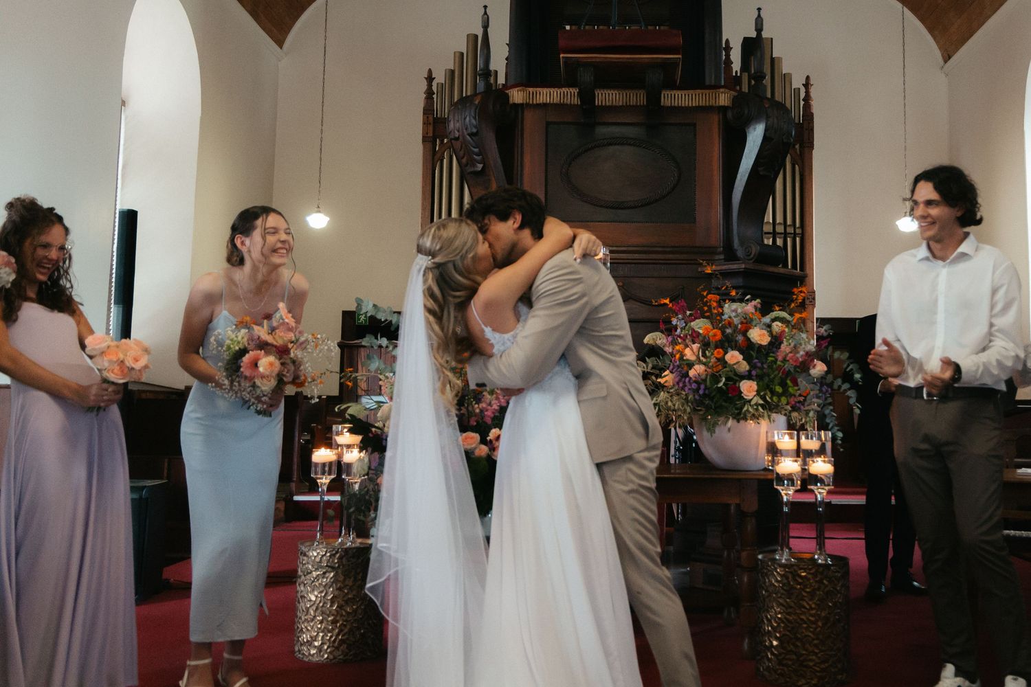 Wedding photography by Crimson and Vow showing a bride and groom hugging at a scenic wedding venue in George, Garden Route.