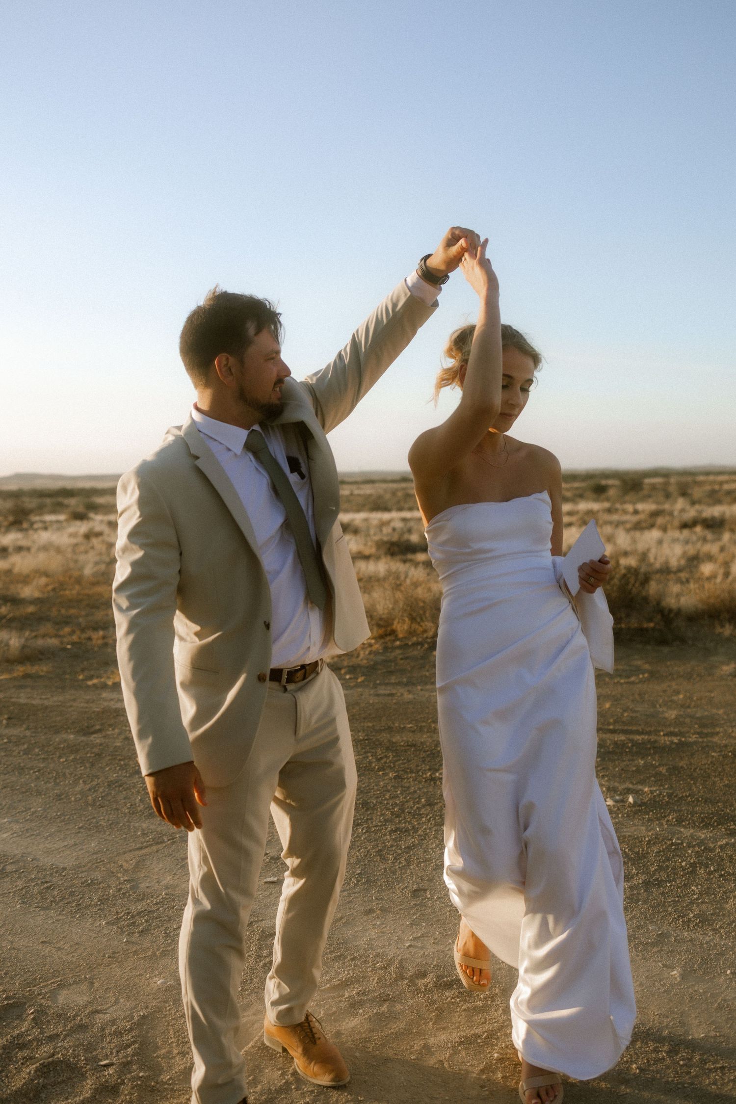 Wedding photography by Crimson and Vow showing a bride and groom hugging at a scenic wedding venue in George, Garden Route.