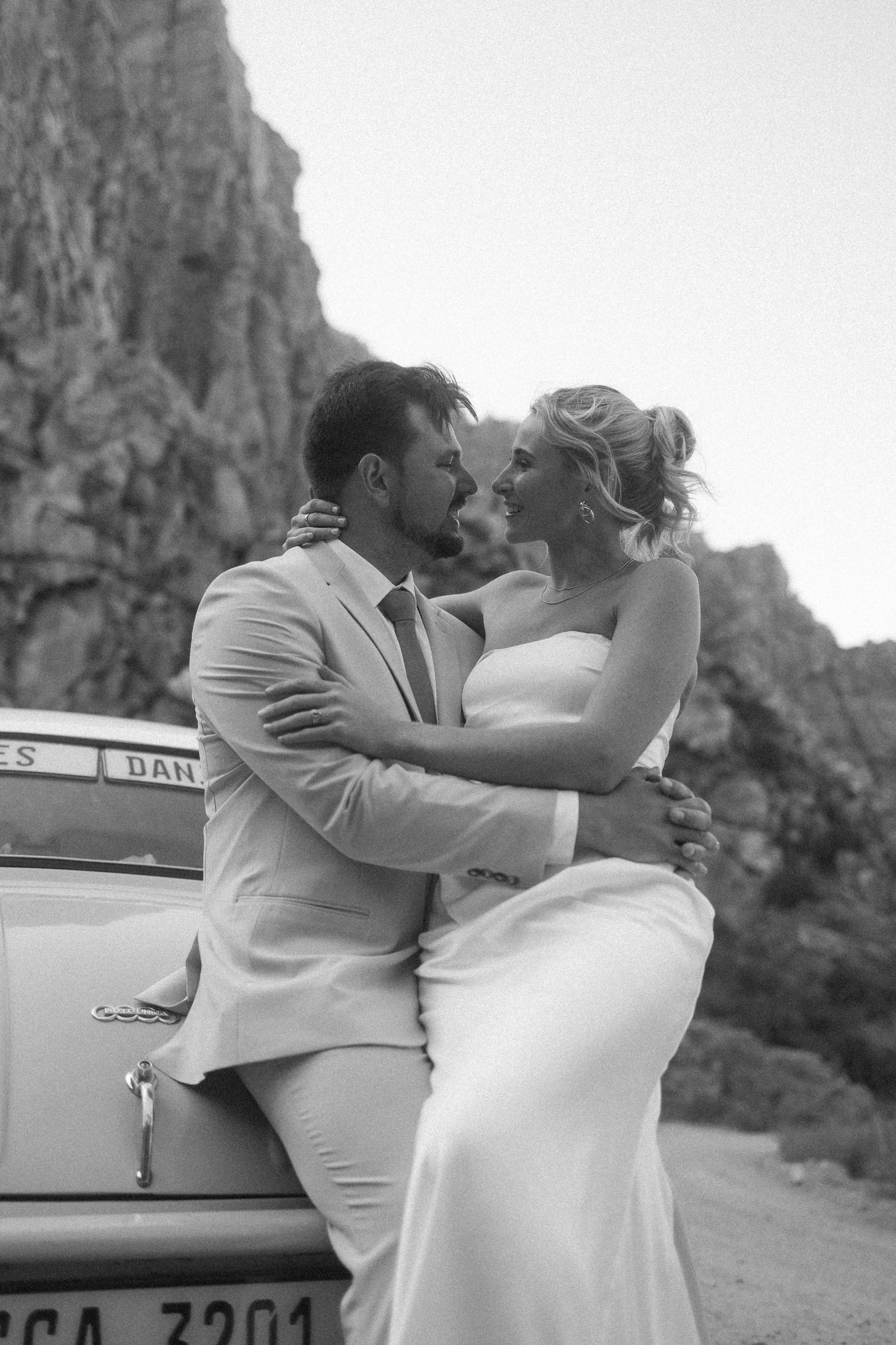 Wedding photography by Crimson and Vow showing a bride and groom hugging at a scenic wedding venue in George, Garden Route.