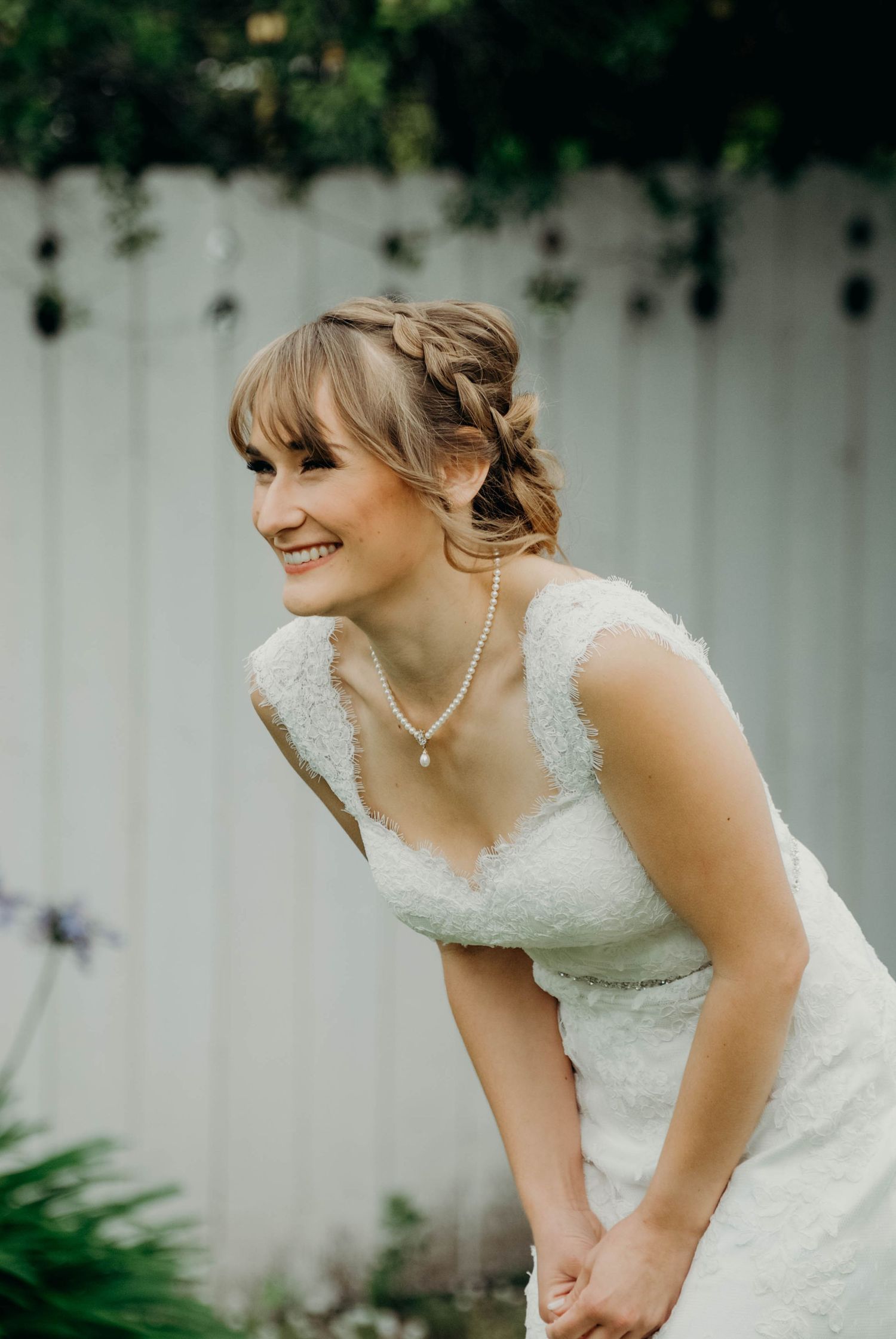 Candid reaction of the bride seeing her groom tear up during their first look ahead of their wedding ceremony.