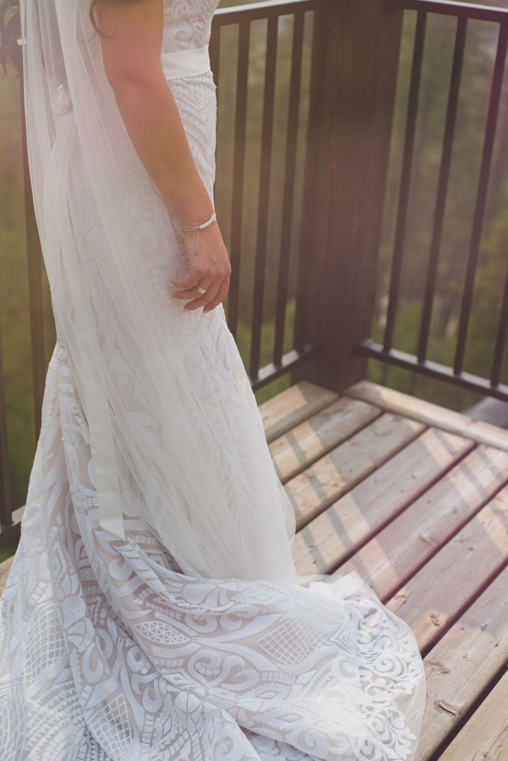 Close up details of the bride's lace gown.