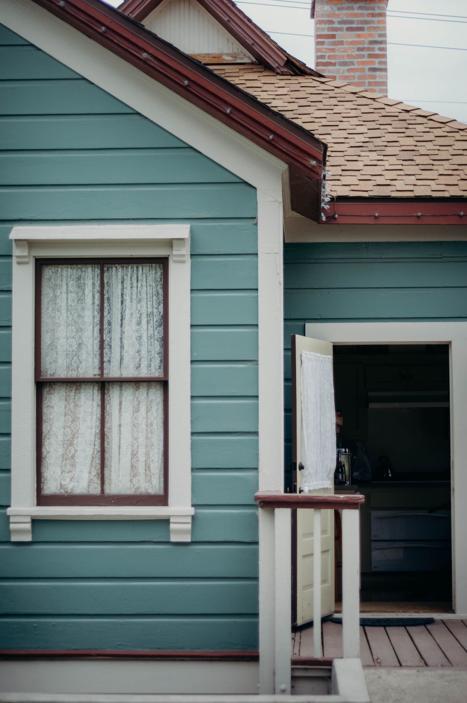 Cute blue sided house which serves as the bridal party's venue to get ready for the wedding.