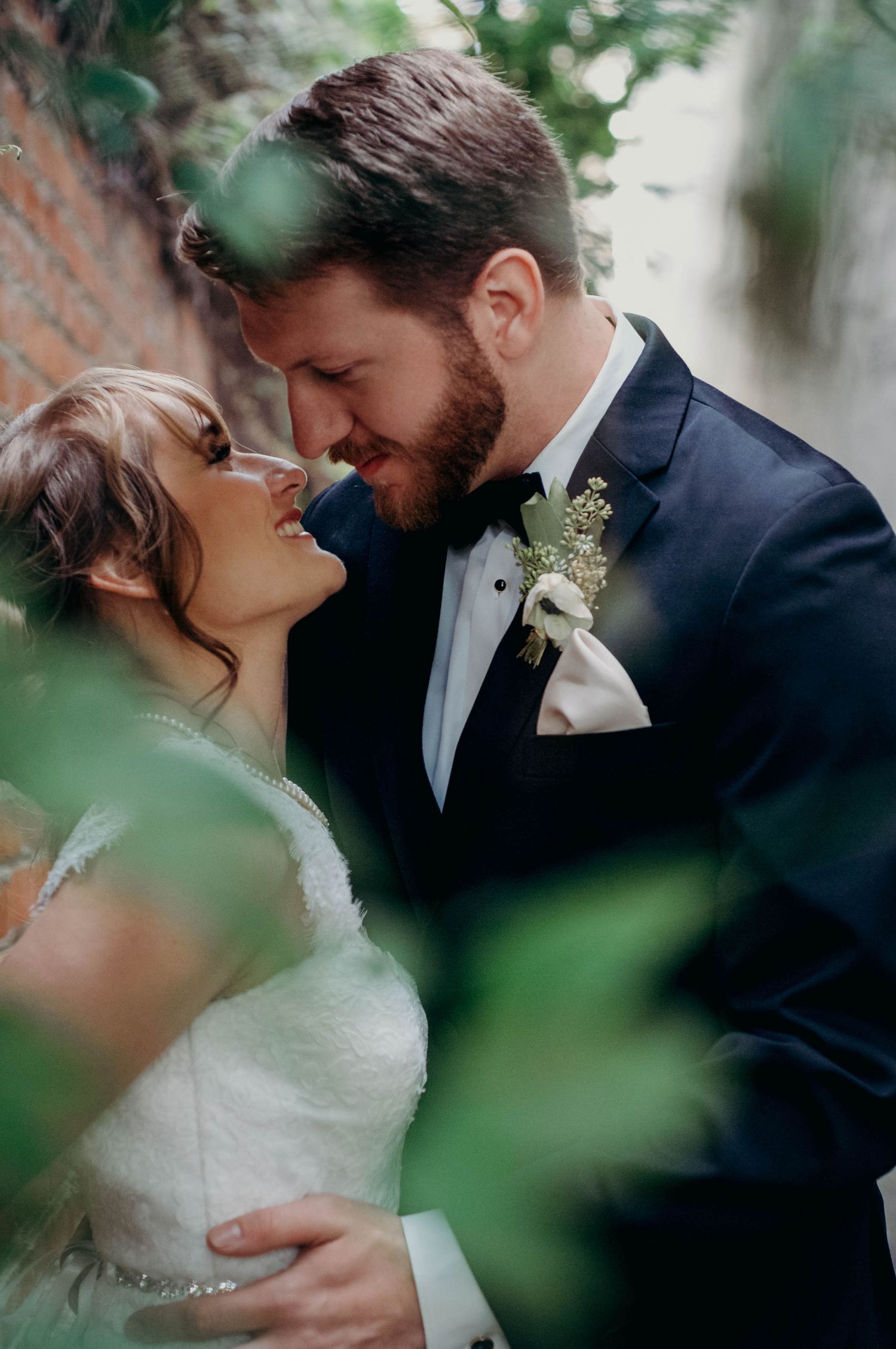 Bride and groom sharing an intimate moment together after their wedding ceremony.