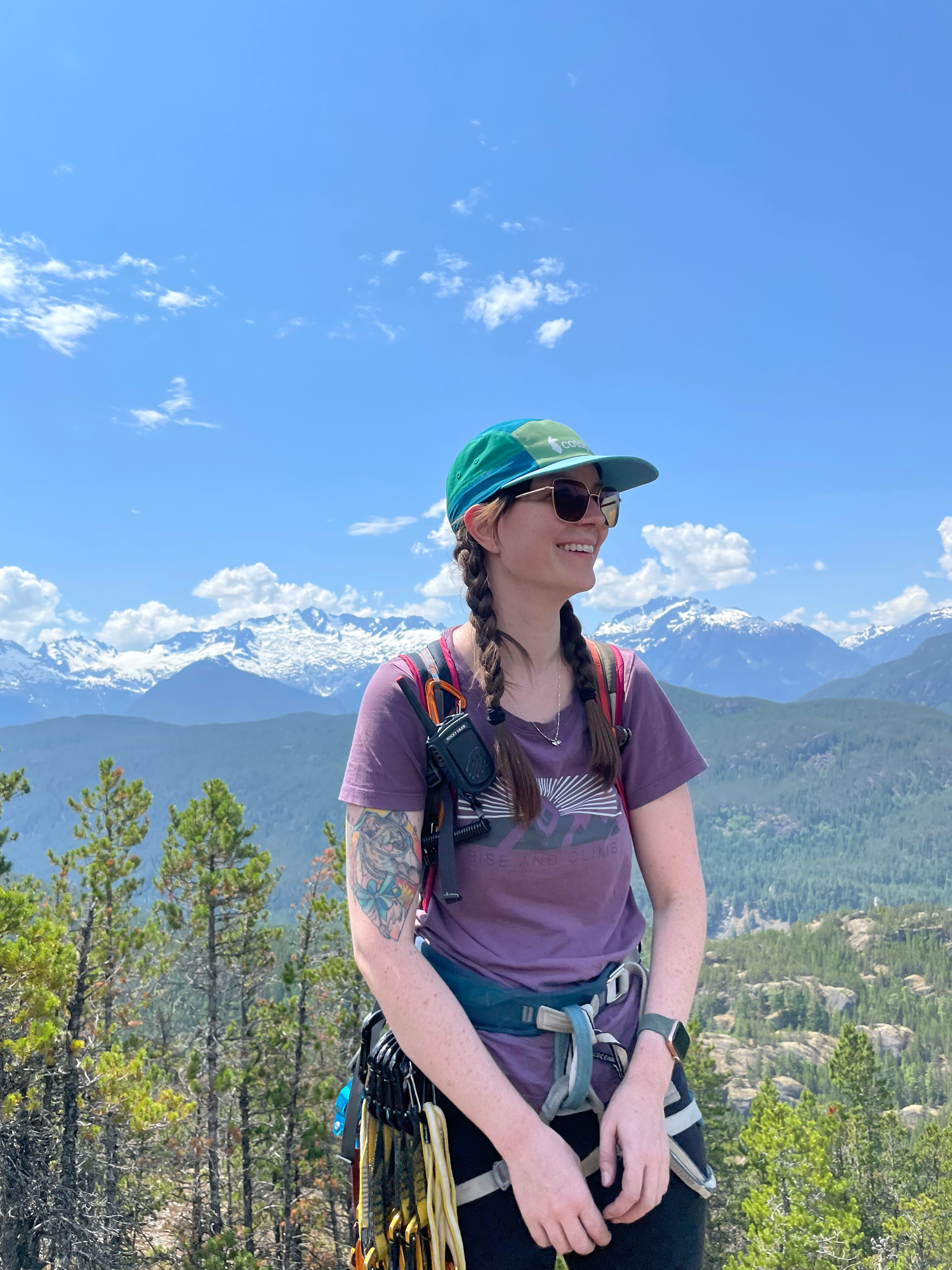 Photographer smiles in climbing gear.