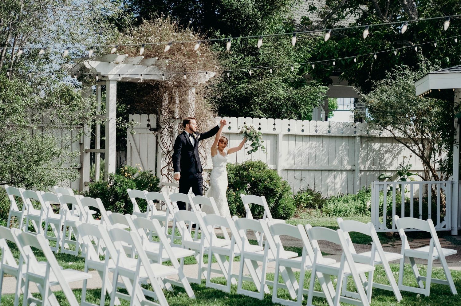 Bride and groom dance together as they enter the reception as a married couple.