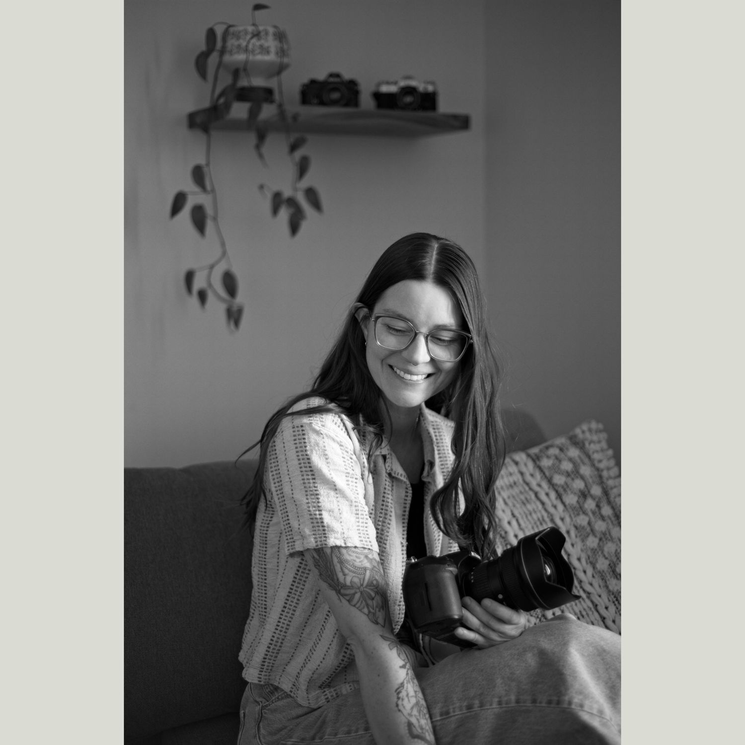 Photographer smiling and holding her camera.