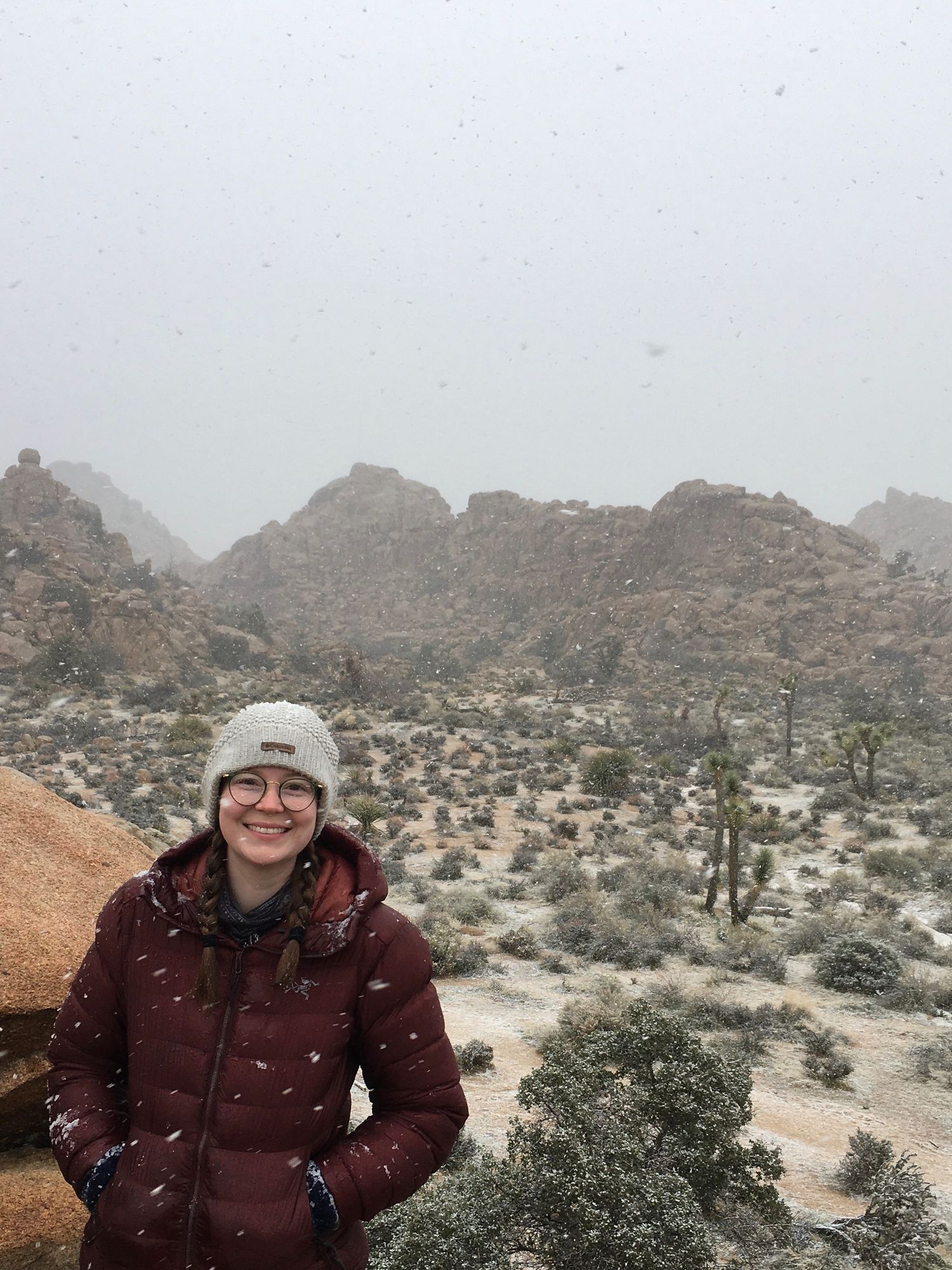 Photographer smiles as it snows in Joshua Tree, California.